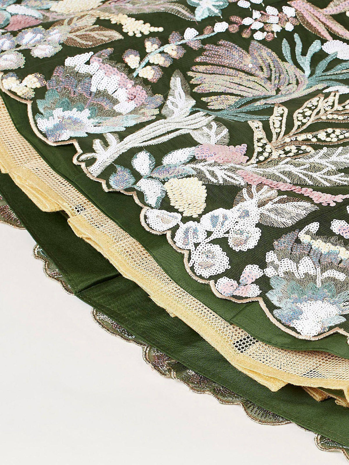 Green ethnic gown with floral embroidery and sequin detailing, featuring gold lace trim.
