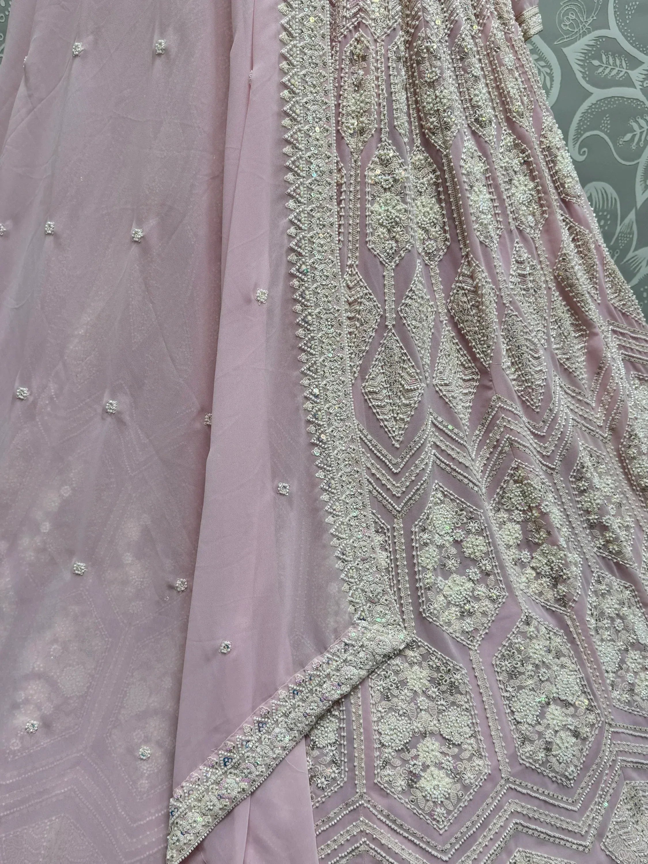 Dusty pink lehenga with intricate silver beadwork and sequin embroidery, perfect for Indian ethnic occasions.