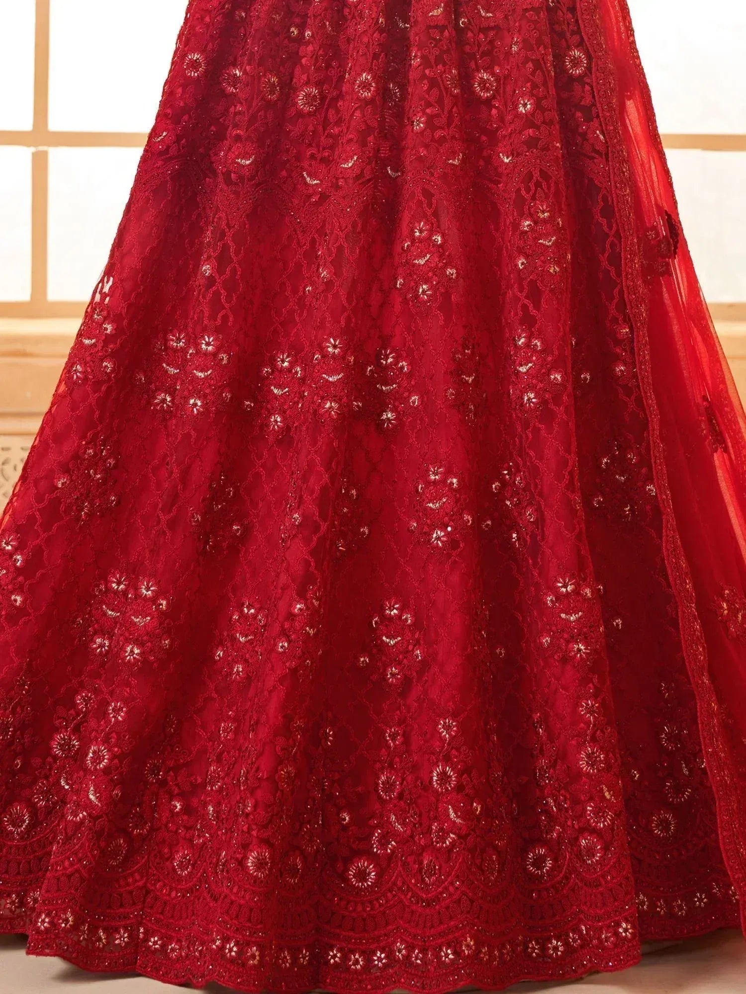 Red embroidered lehenga with floral lace detailing, perfect for Indian ethnic wear occasions