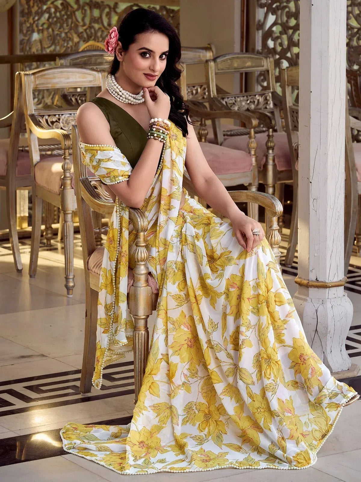 Woman in yellow floral lehenga choli with pearl trim, styled for Indian ethnic wear occasions