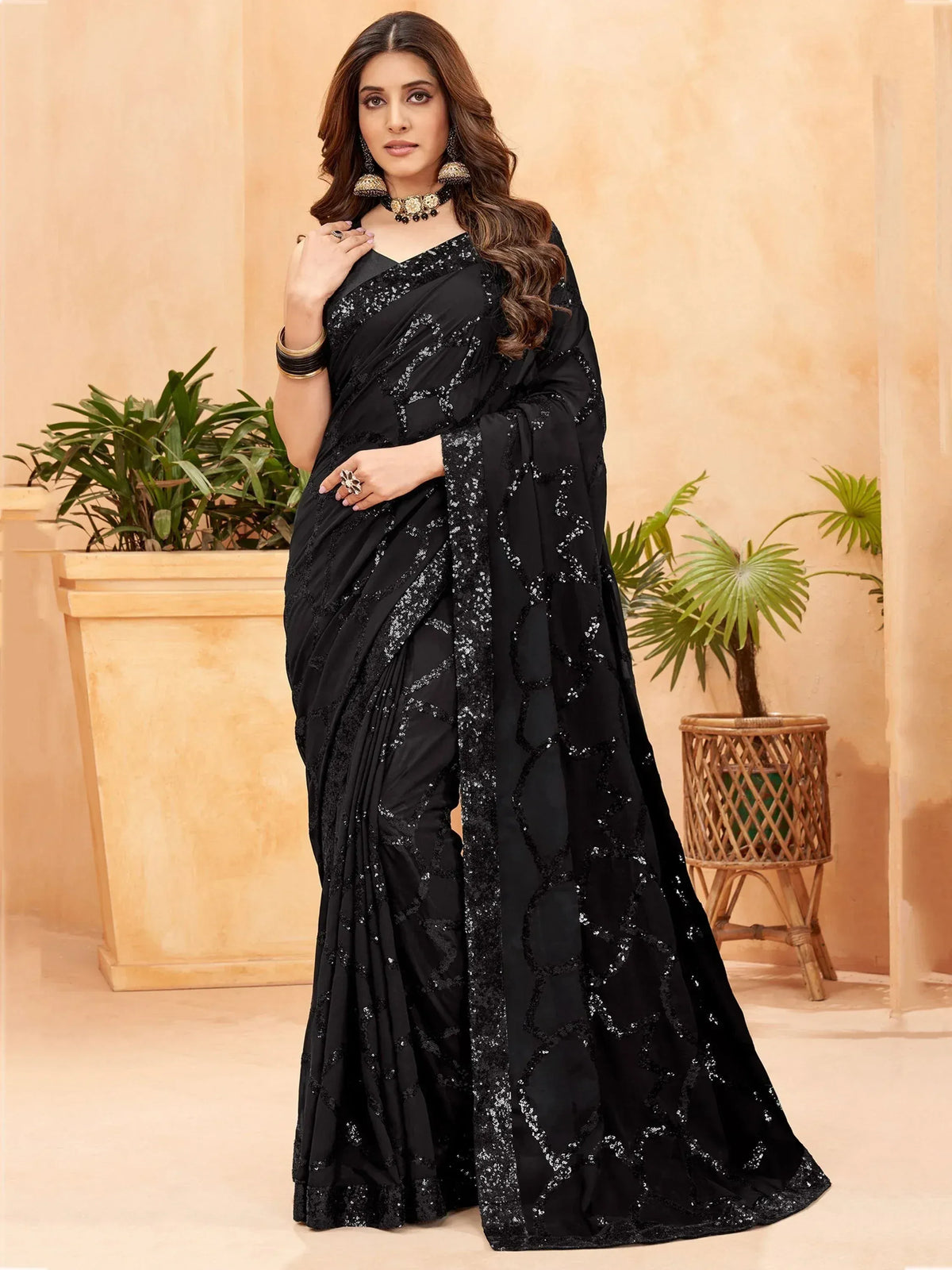 Black sequin embroidered saree with V-neck blouse, perfect for Indian ethnic wear events