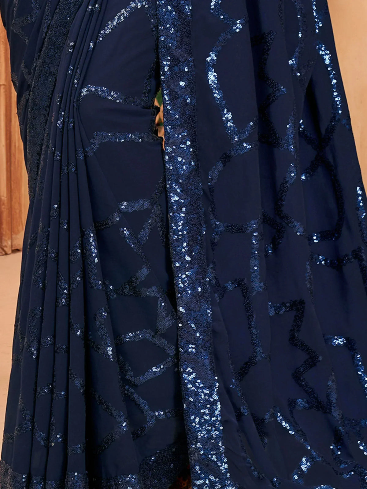 Navy blue saree with geometric sequin embroidery, elegant Indian ethnic wear for festive occasions