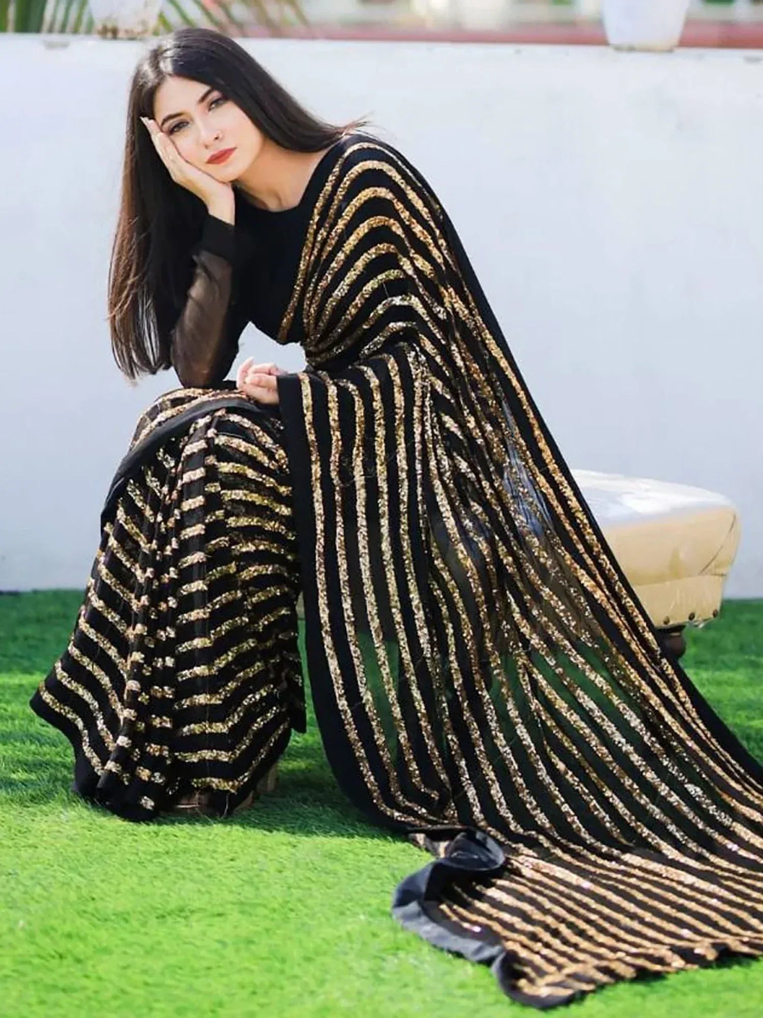 Black and gold striped ethnic gown with sheer sleeves, perfect for Indian festive occasions