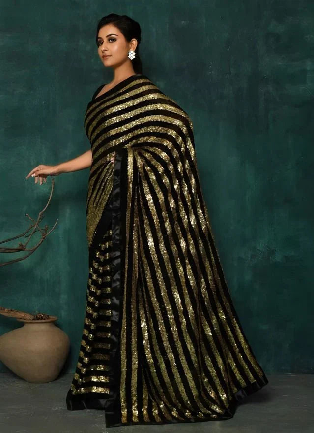 Charming Black Georgette Striped Reception Wear Saree With Blouse