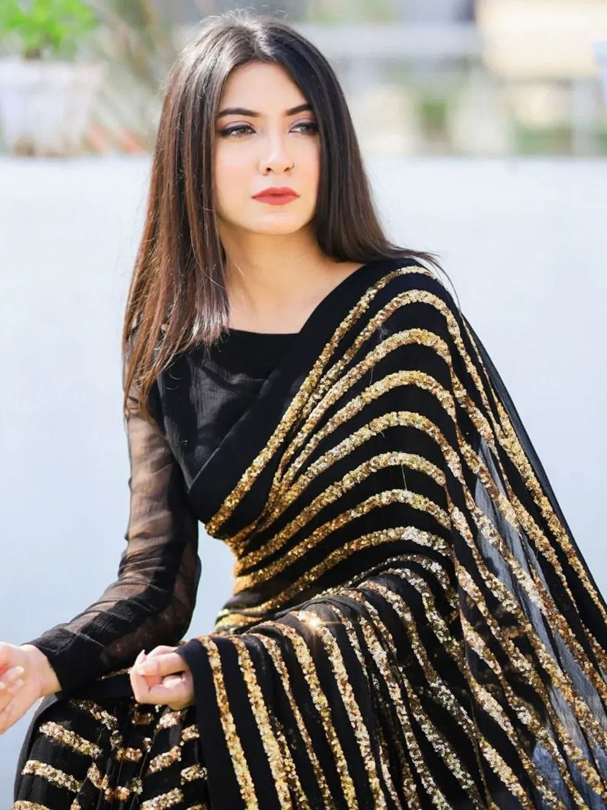 Black and gold sequin ethnic gown with sheer sleeves, perfect for Indian festive occasions