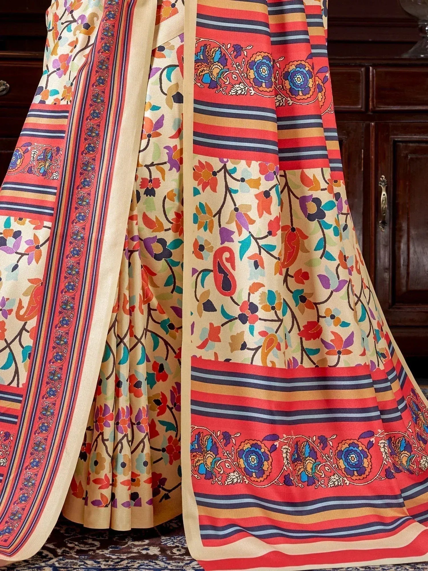 Colorful floral and striped ethnic saree with vibrant border designs, perfect for Indian occasions