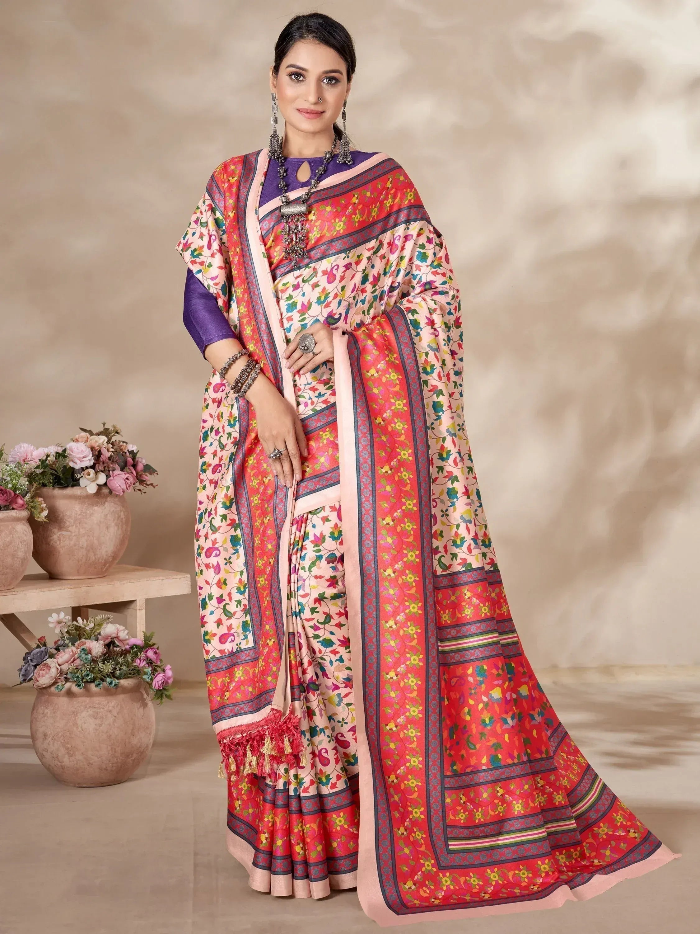Woman in colorful floral printed saree with purple blouse, ethnic Indian wear for festive occasions