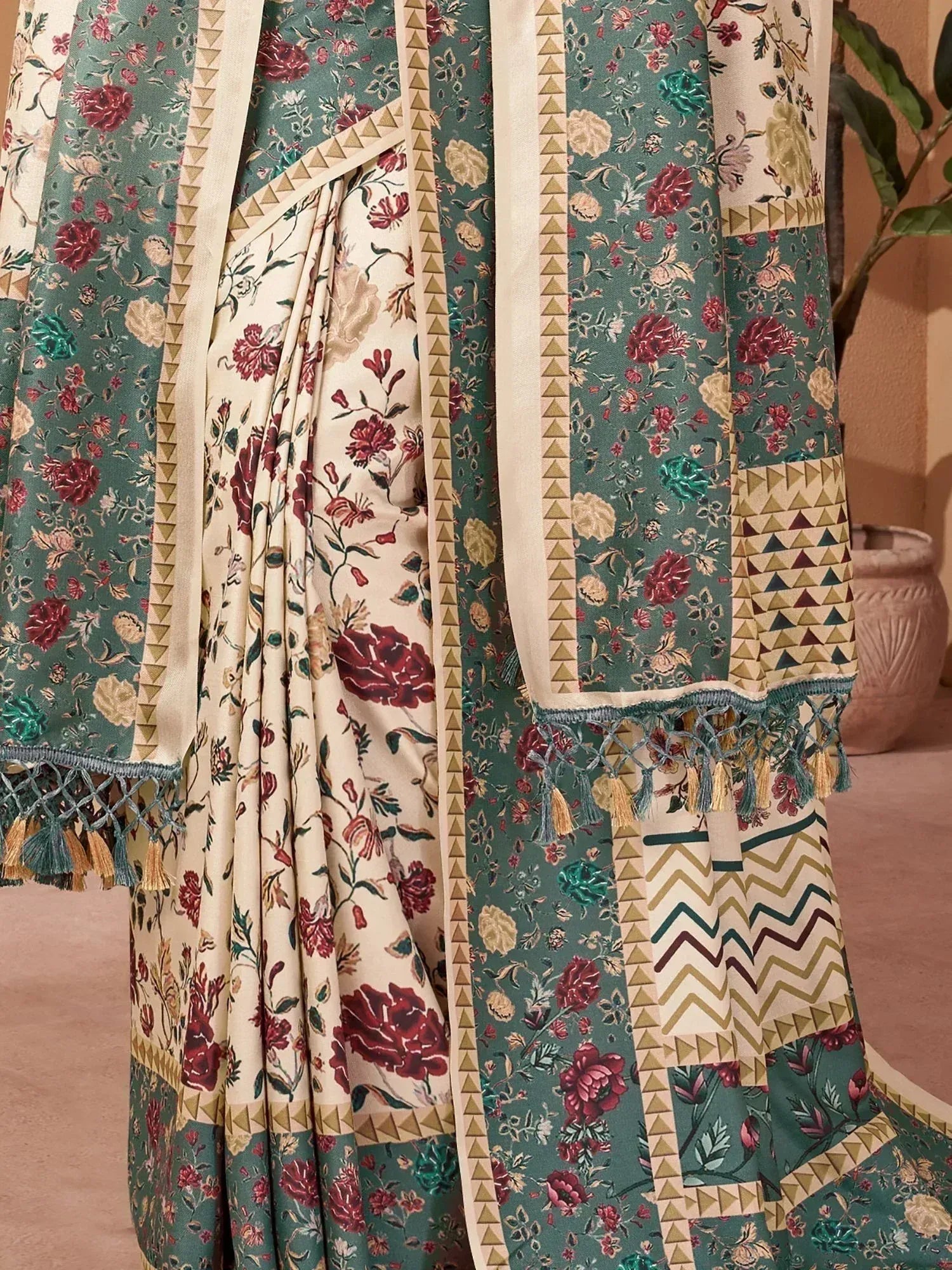 Floral print saree with geometric border and tassels, ethnic Indian wear