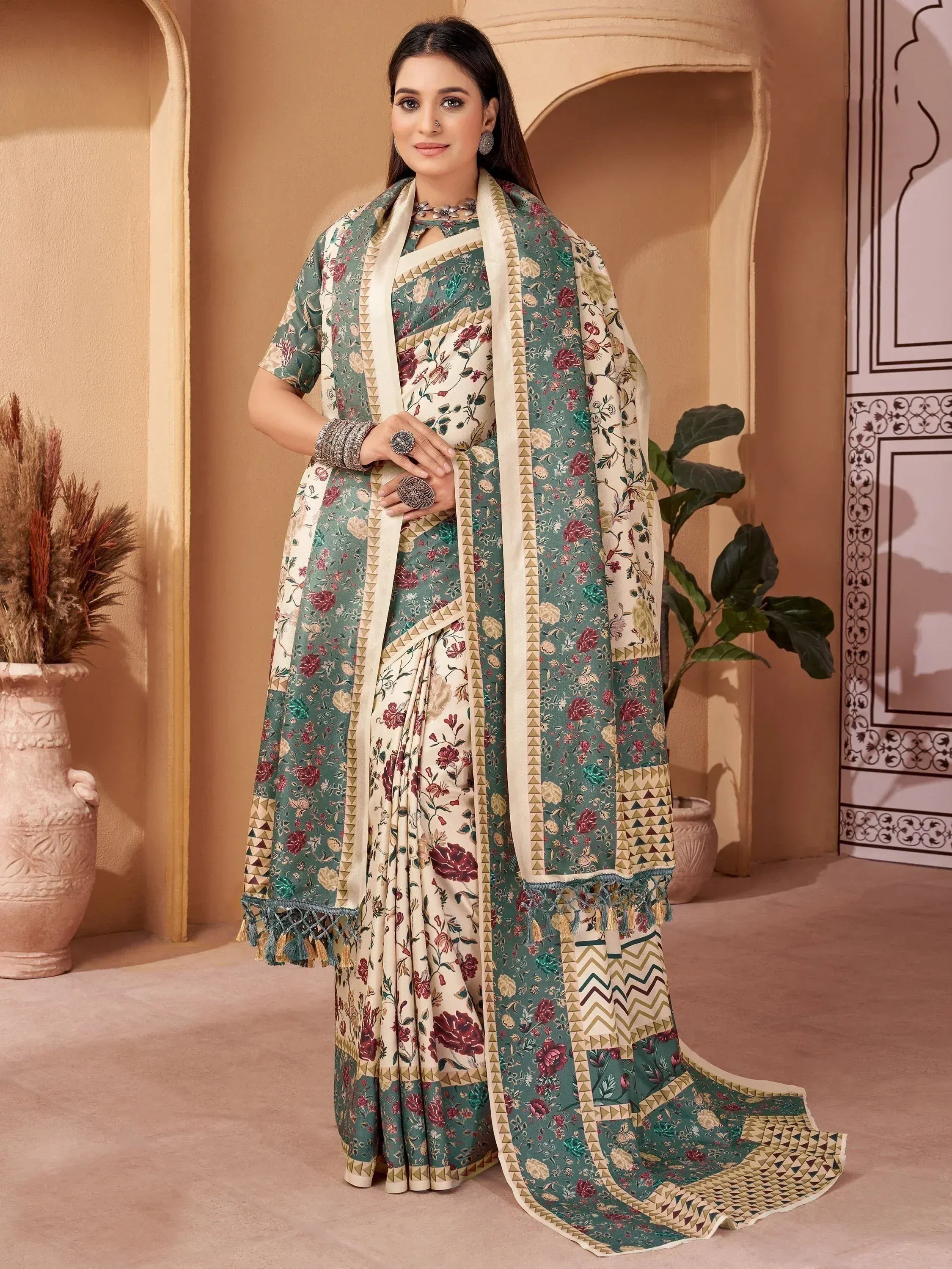 Floral print ethnic saree with geometric border and tassels, perfect for Indian occasions