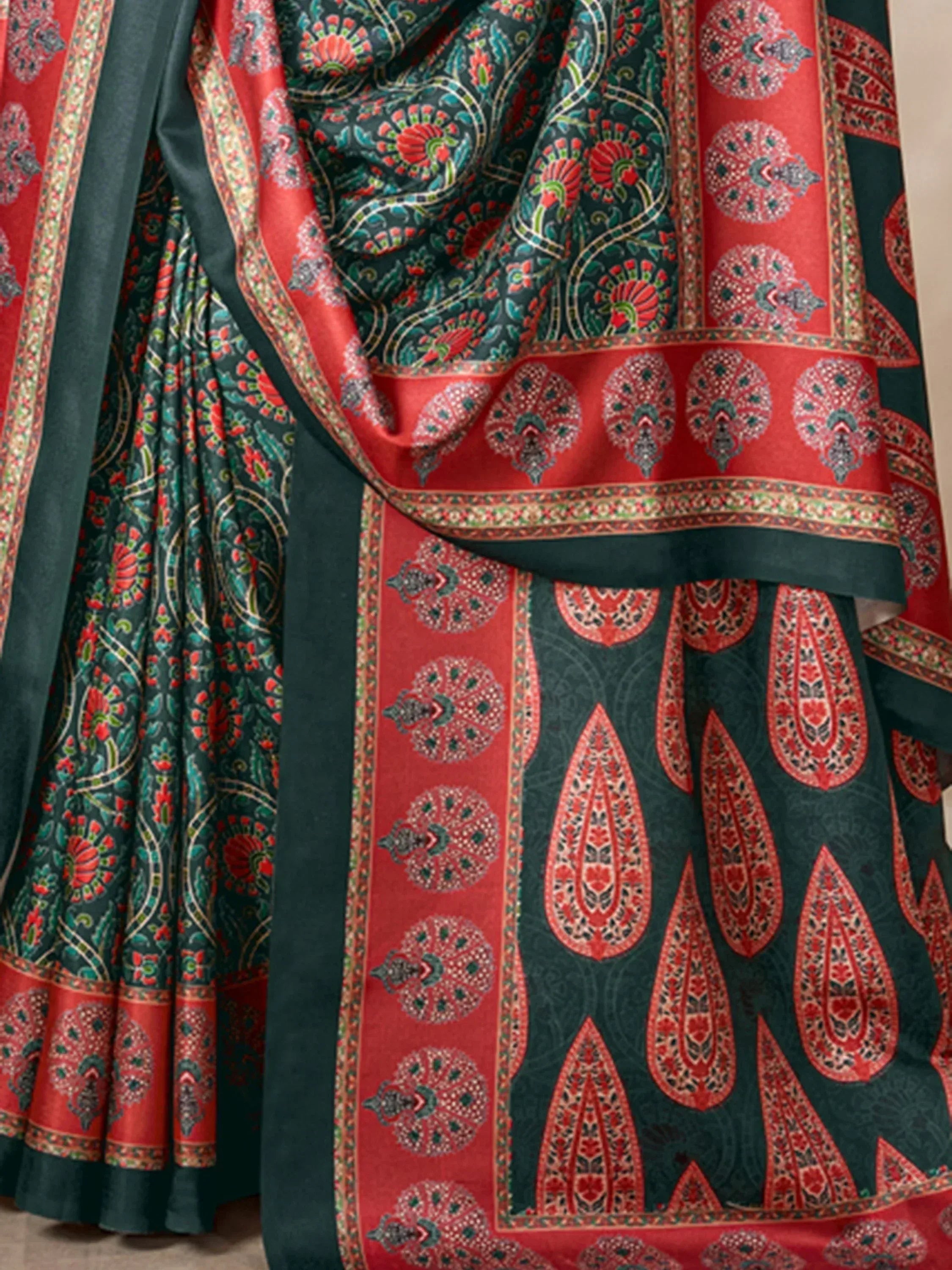 Green and red printed ethnic saree with intricate paisley and floral motifs, perfect for festive occasions.