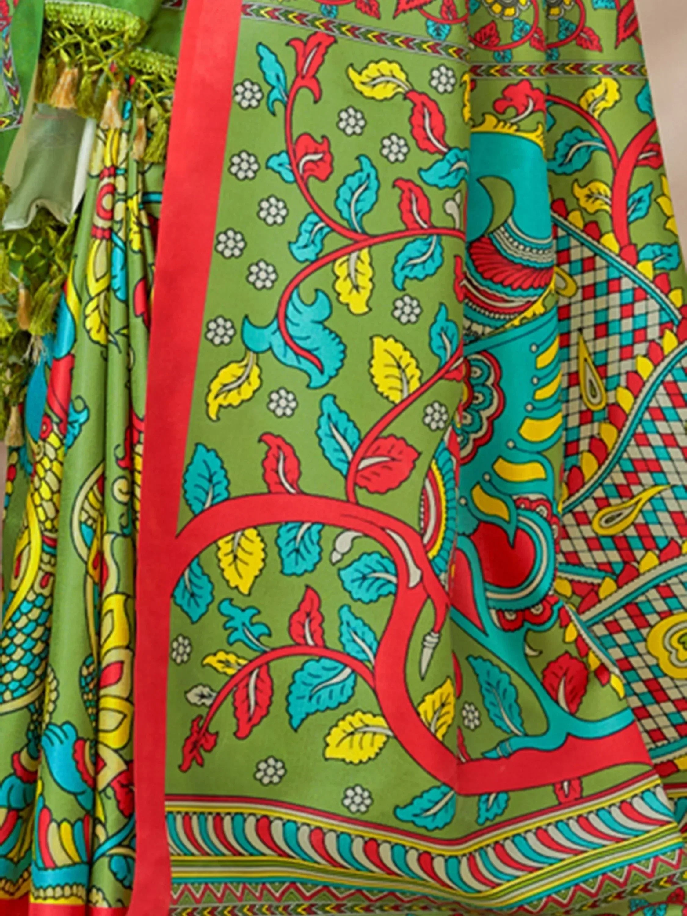 Vibrant green Indian ethnic saree with colorful floral and paisley print, perfect for festive occasions.