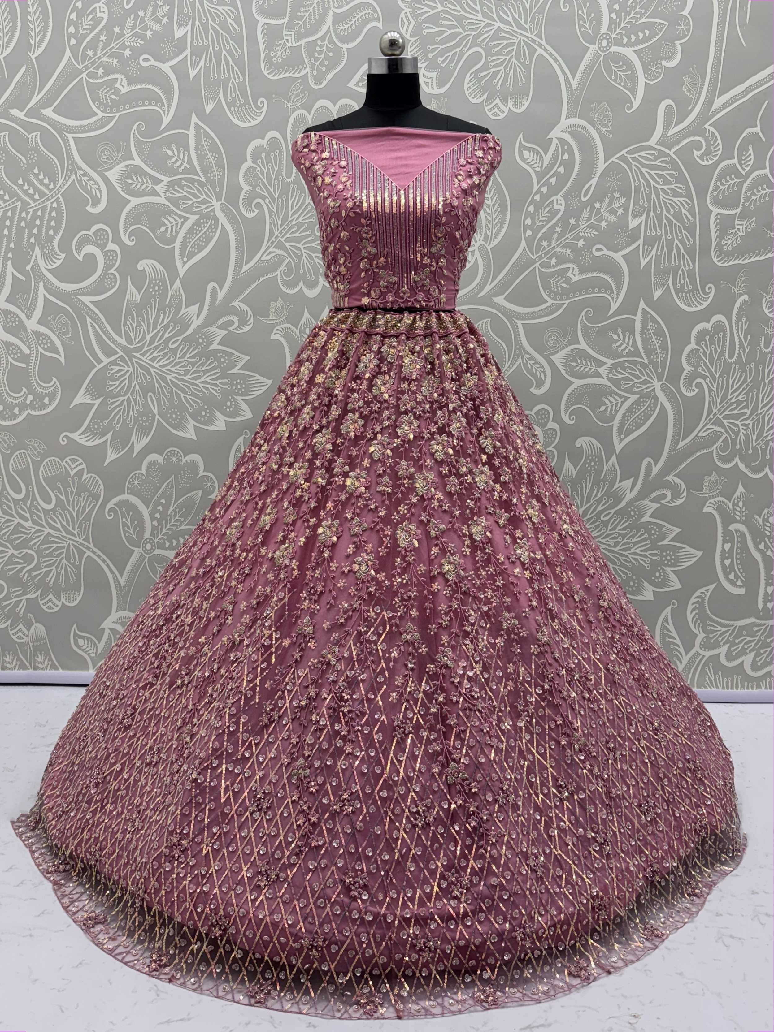 Elegant pink ethnic gown with gold floral embroidery and pleated bodice for festive occasions