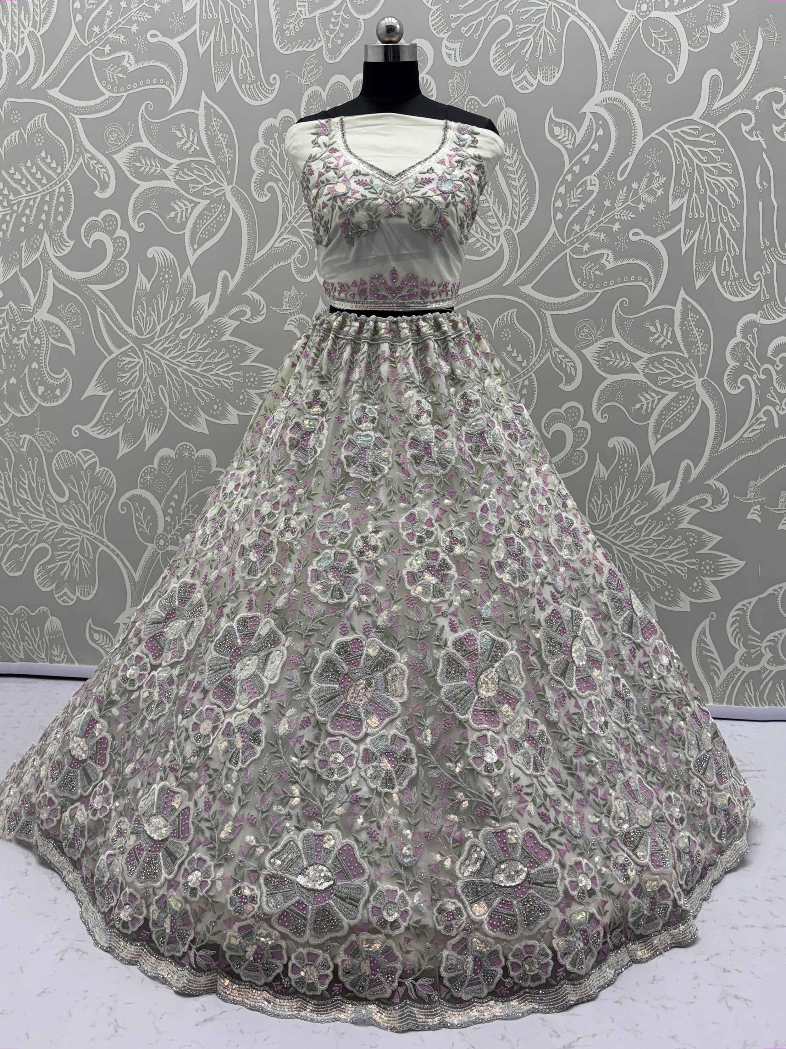 Elegant silver and purple embroidered lehenga choli with floral sequin work, perfect for Indian ethnic occasions.