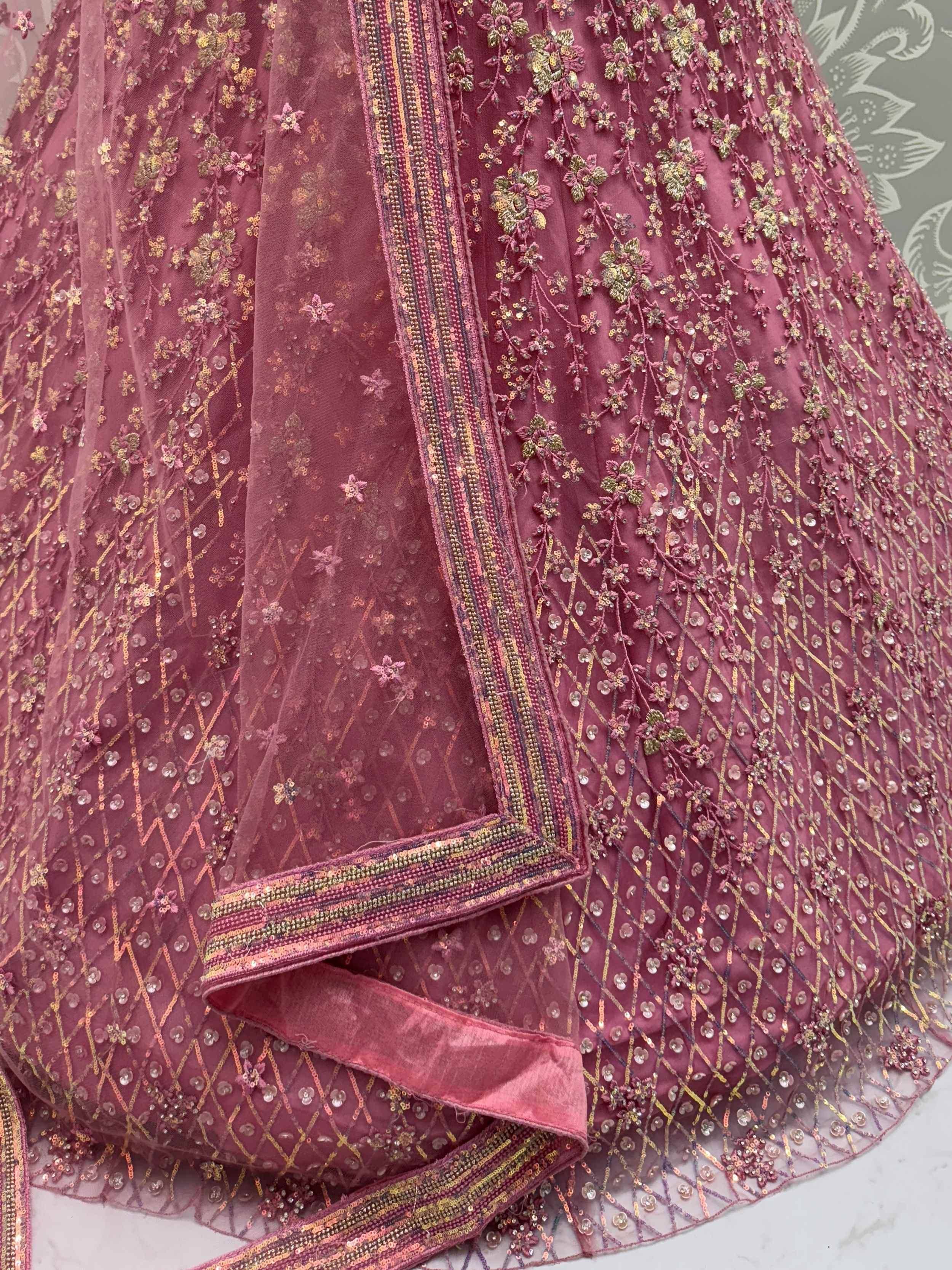Pink embroidered lehenga with floral sequin work and net dupatta, perfect for Indian ethnic wear occasions.