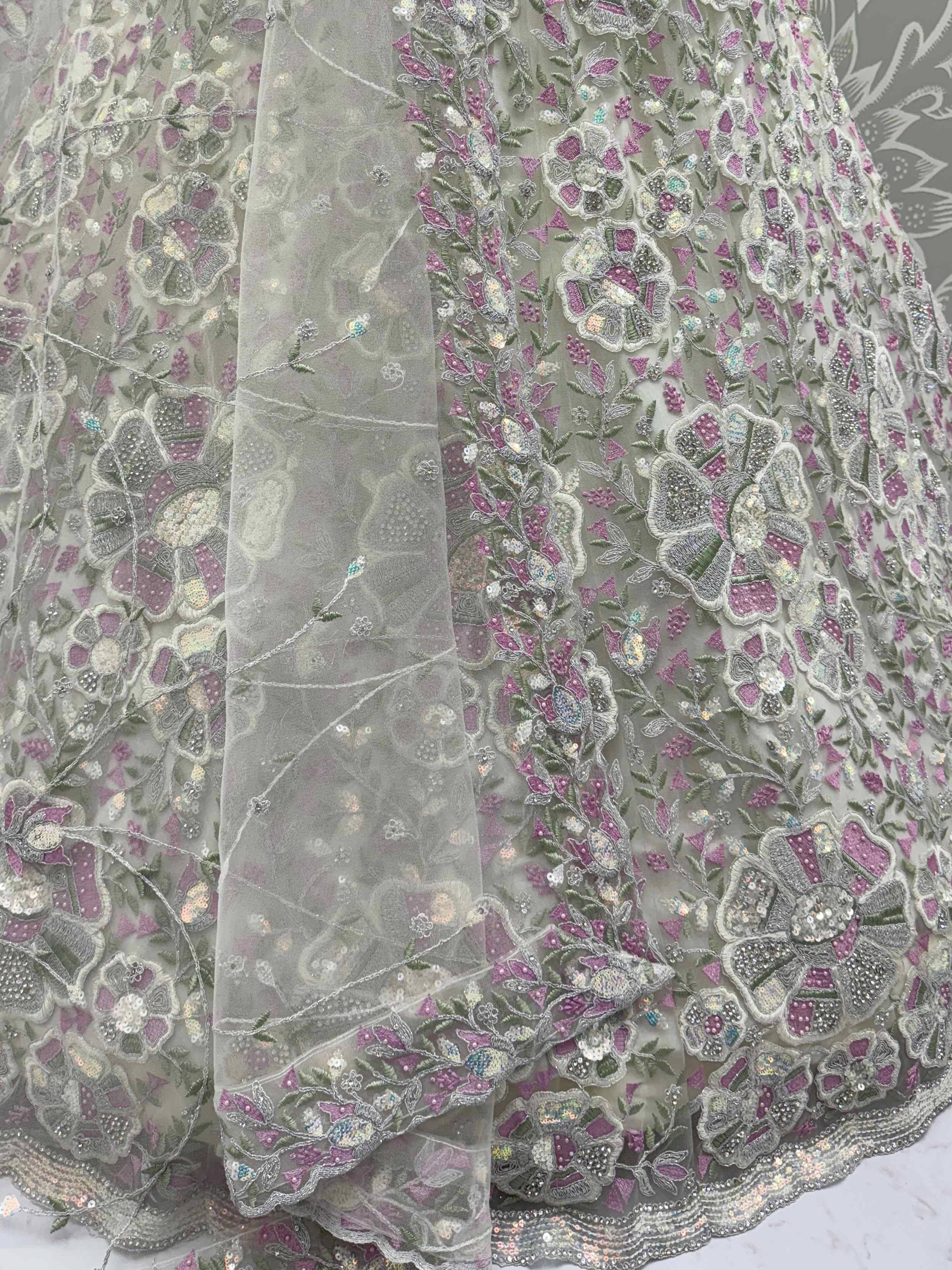 Grey floral embroidered lehenga with pink and green threadwork, sequins, and sheer net overlay