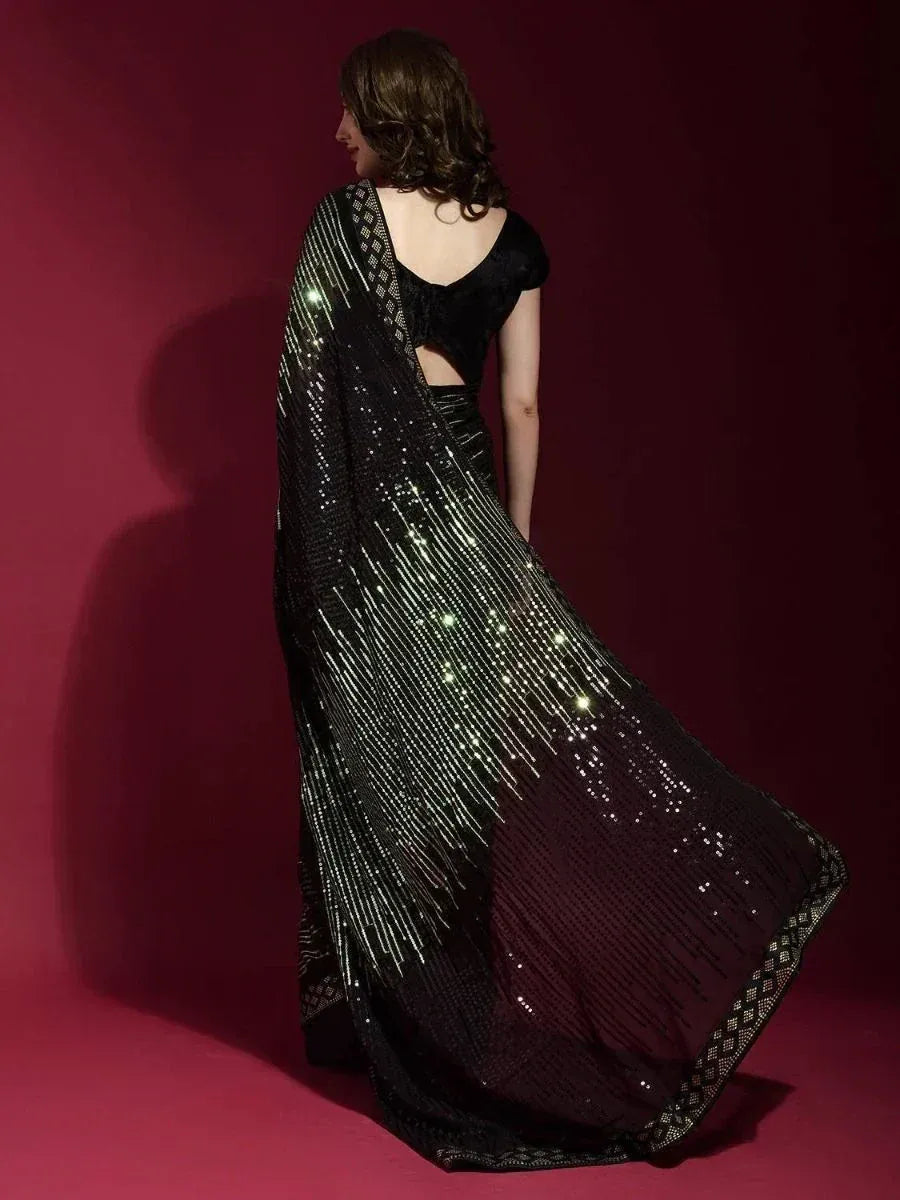 Black sequin saree with shimmering gold stripes, elegant ethnic wear for women