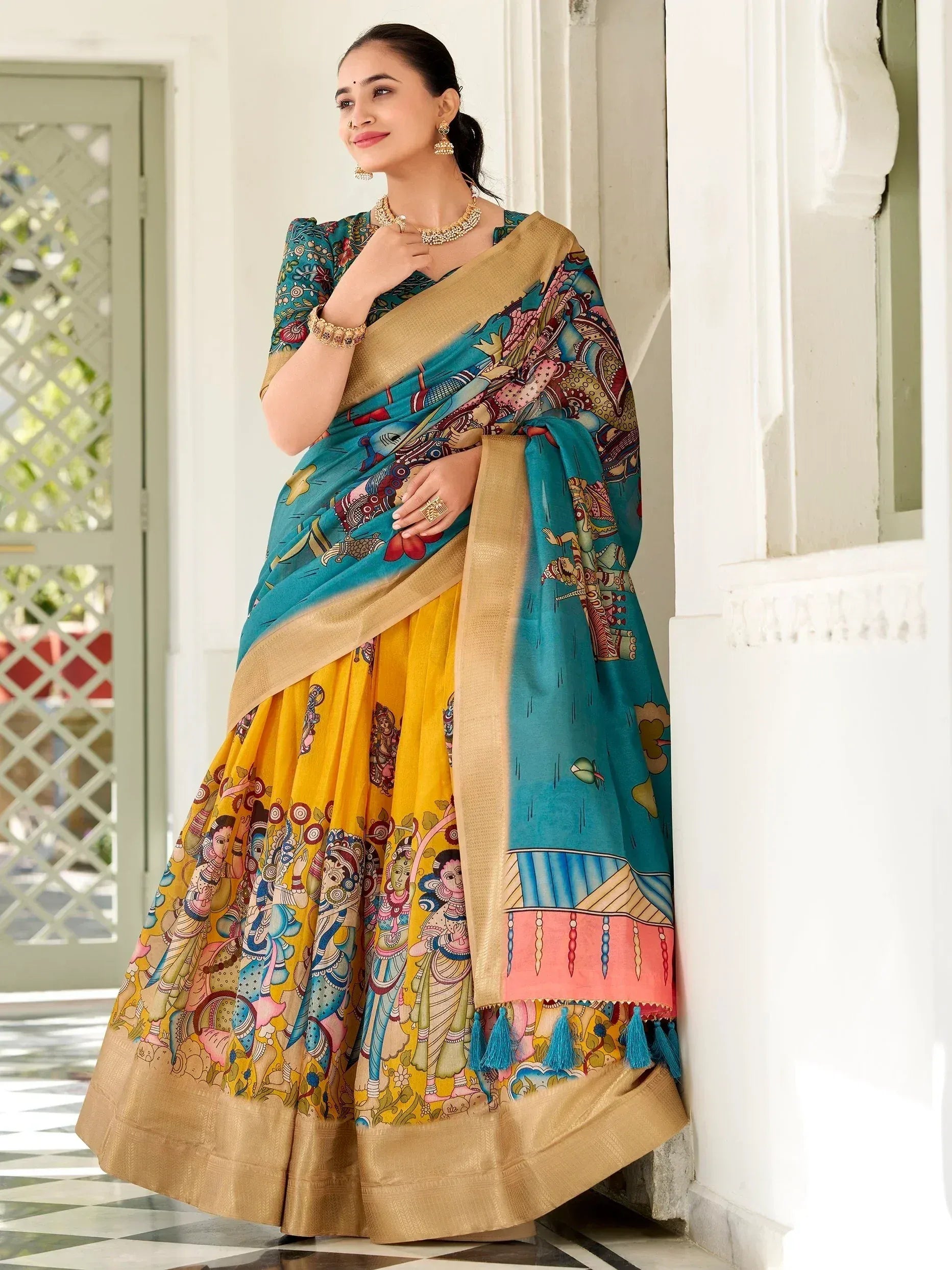 Woman in vibrant printed lehenga choli with turquoise dupatta, ethnic Indian wear for festive occasions