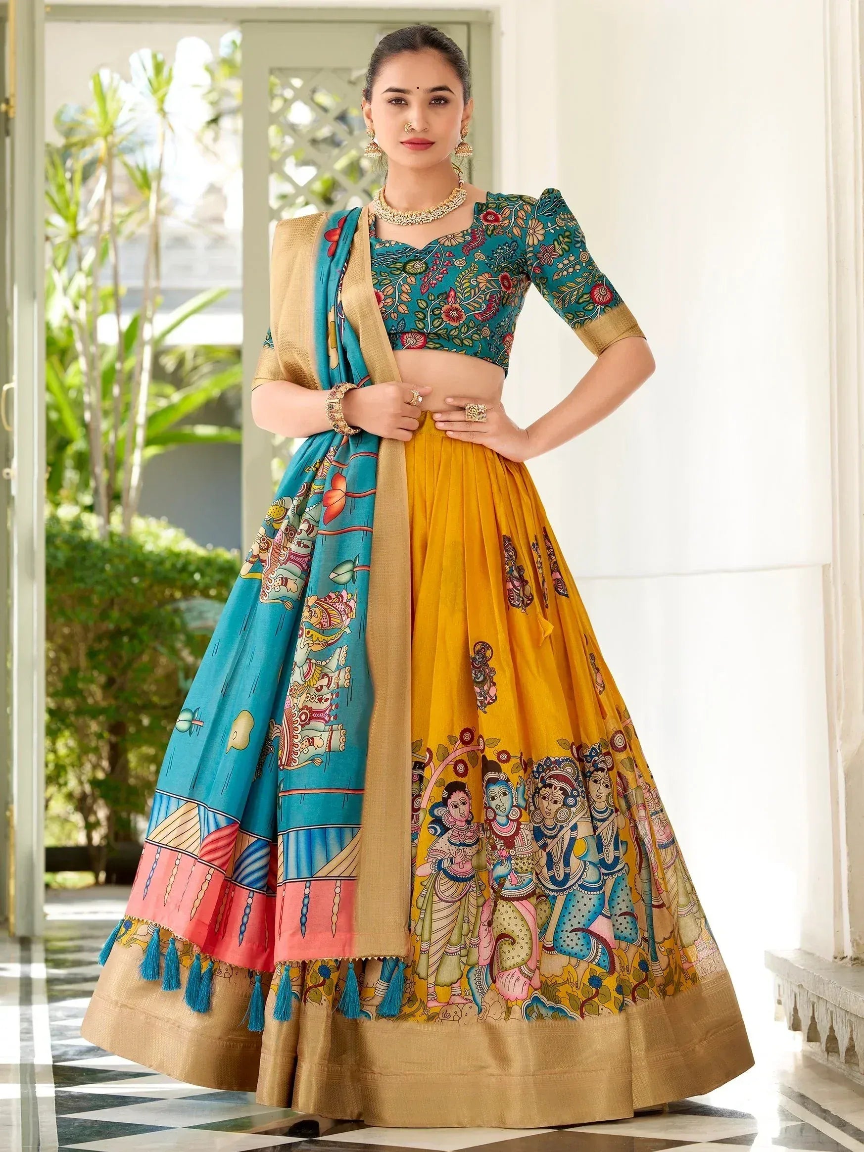 Designer lehenga choli with floral blouse, printed yellow skirt, and blue dupatta for Indian ethnic wear