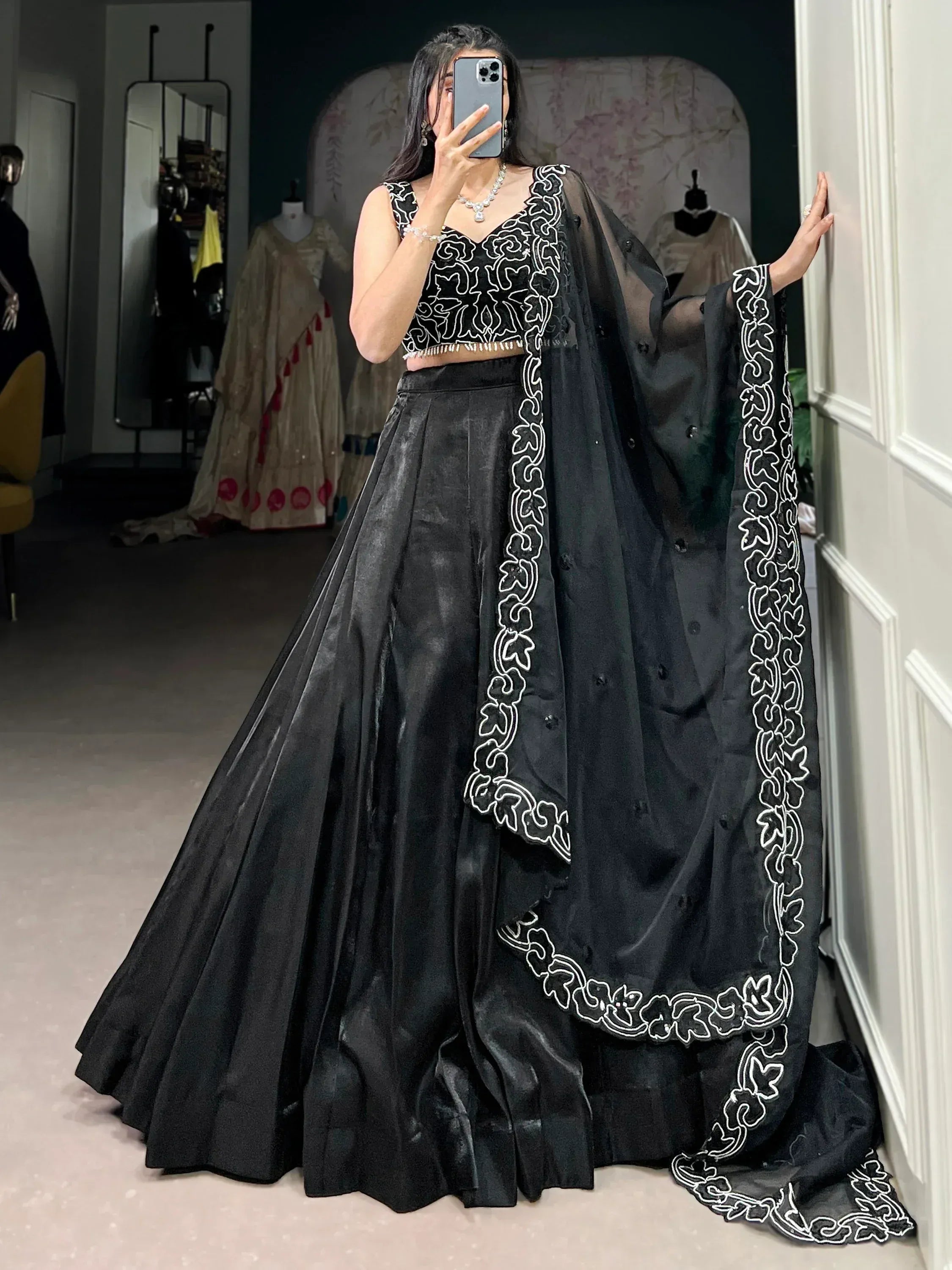 Black embroidered lehenga choli with white detailing, perfect for Indian ethnic wear events