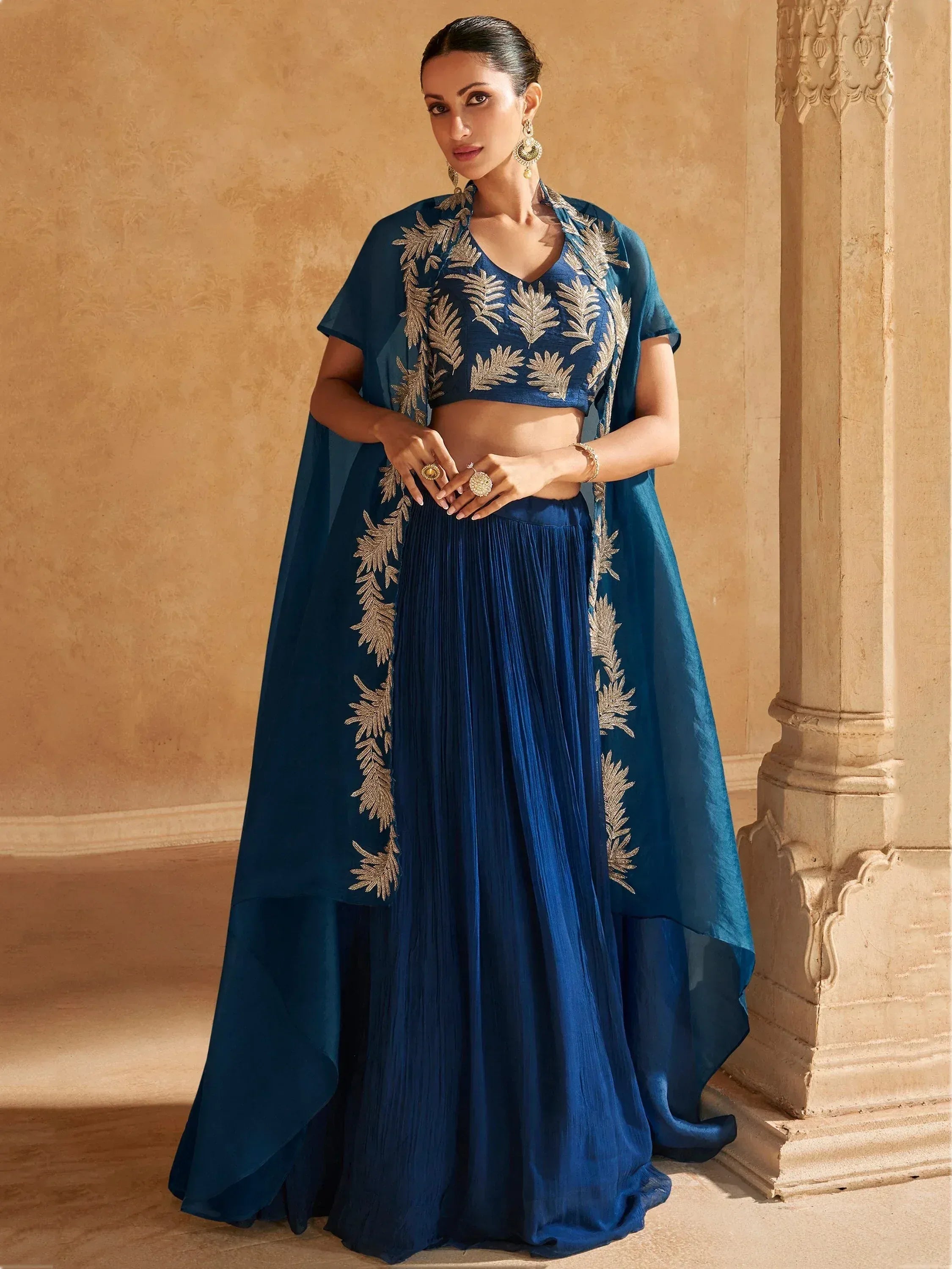 Blue embroidered lehenga choli with gold leaf detailing, perfect for Indian ethnic occasions