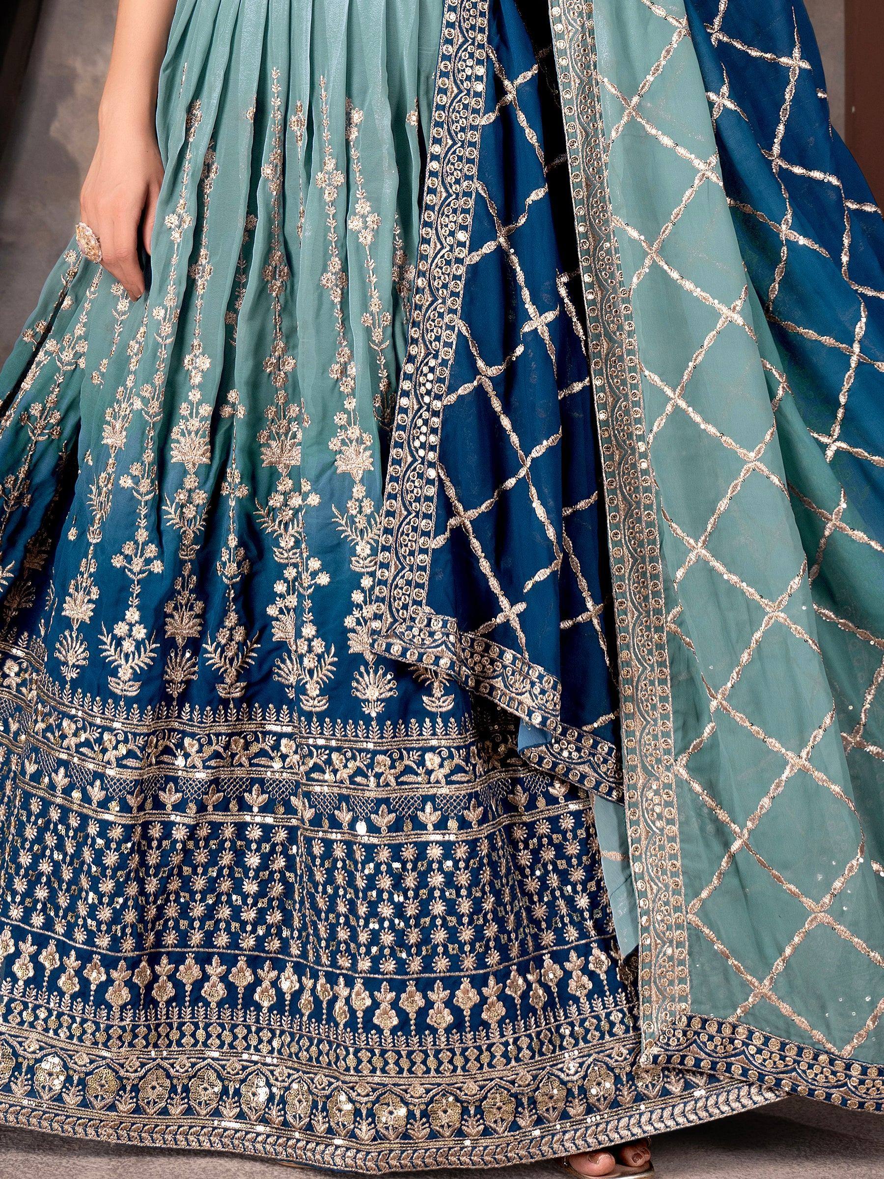 Blue and teal lehenga choli with gold embroidery and sequin work, perfect for Indian ethnic wear occasions.