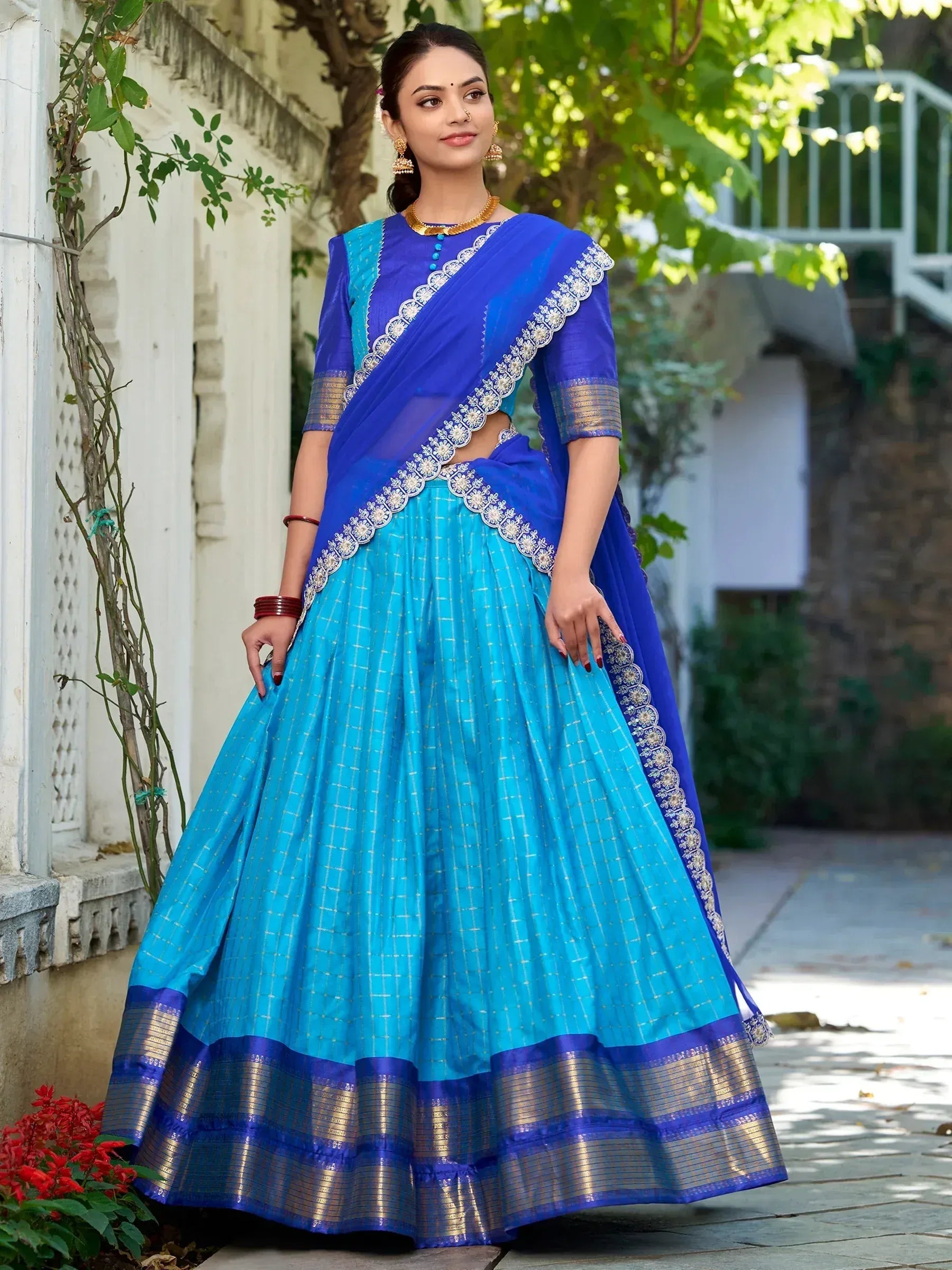 Blue and turquoise lehenga choli with gold embroidery and border, perfect for Indian ethnic wear