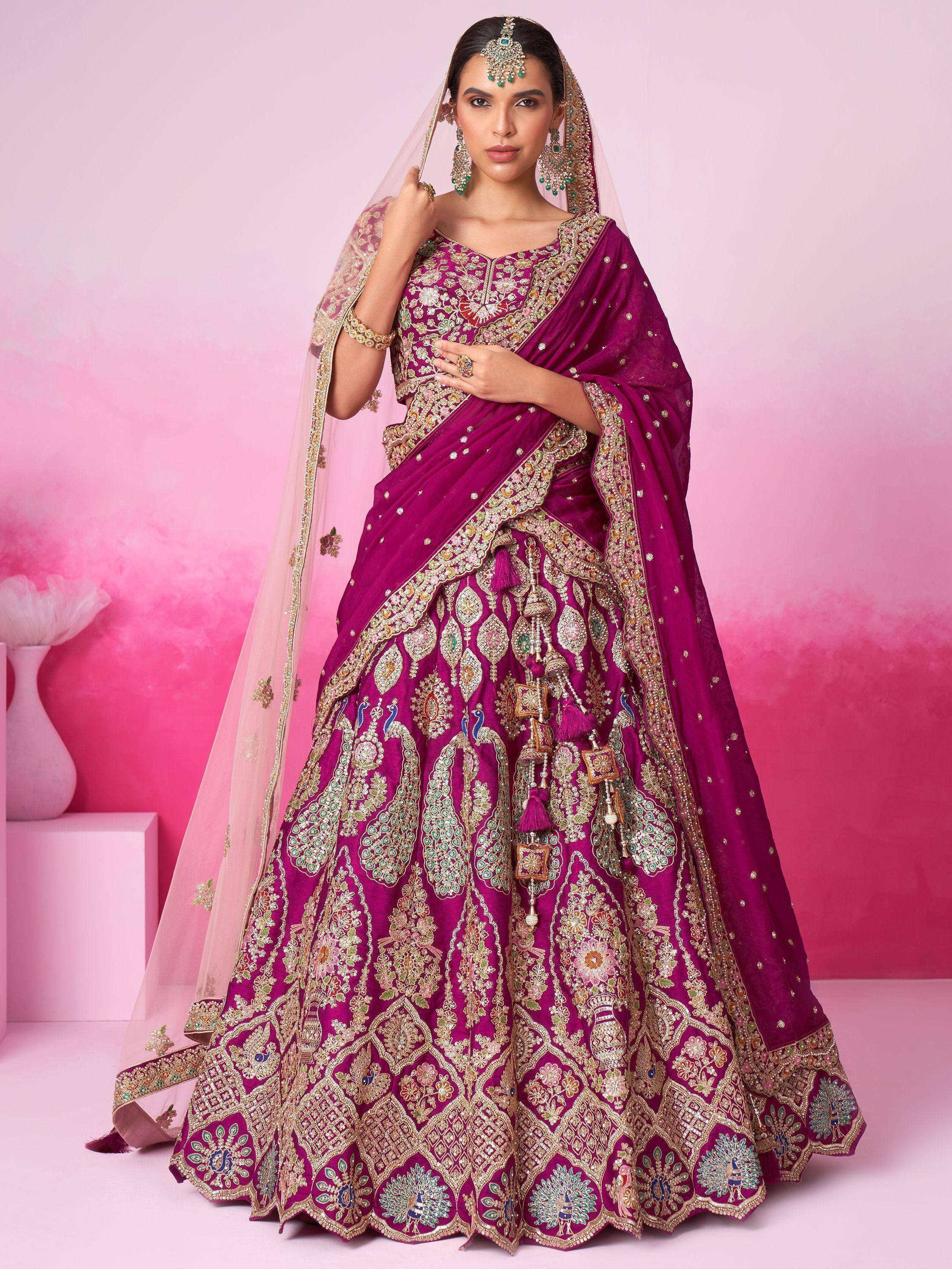 Purple designer lehenga choli with heavy embroidery and peacock motifs, perfect for Indian weddings