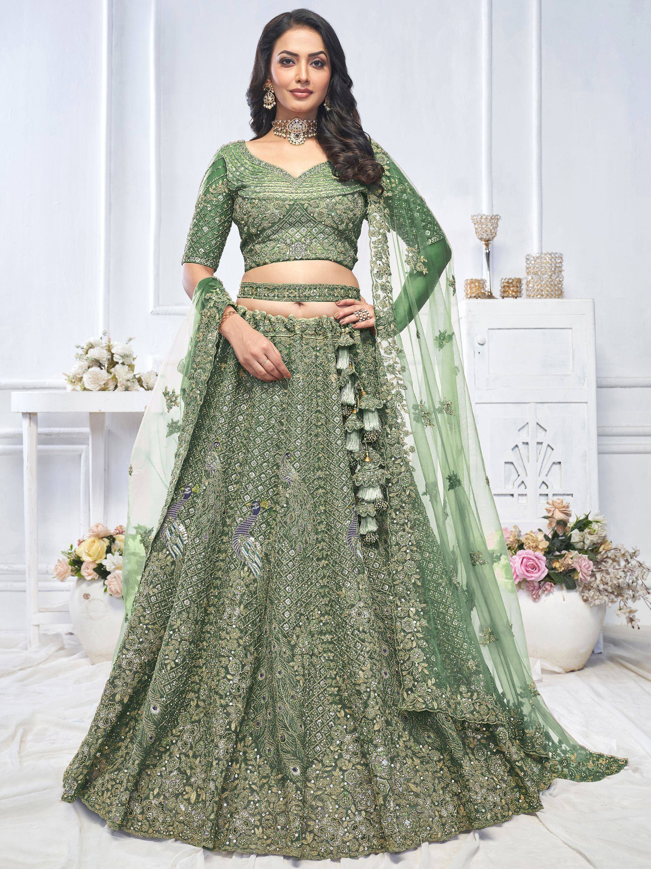 Emerald green designer lehenga choli with peacock embroidery and gold zari work, perfect for weddings.