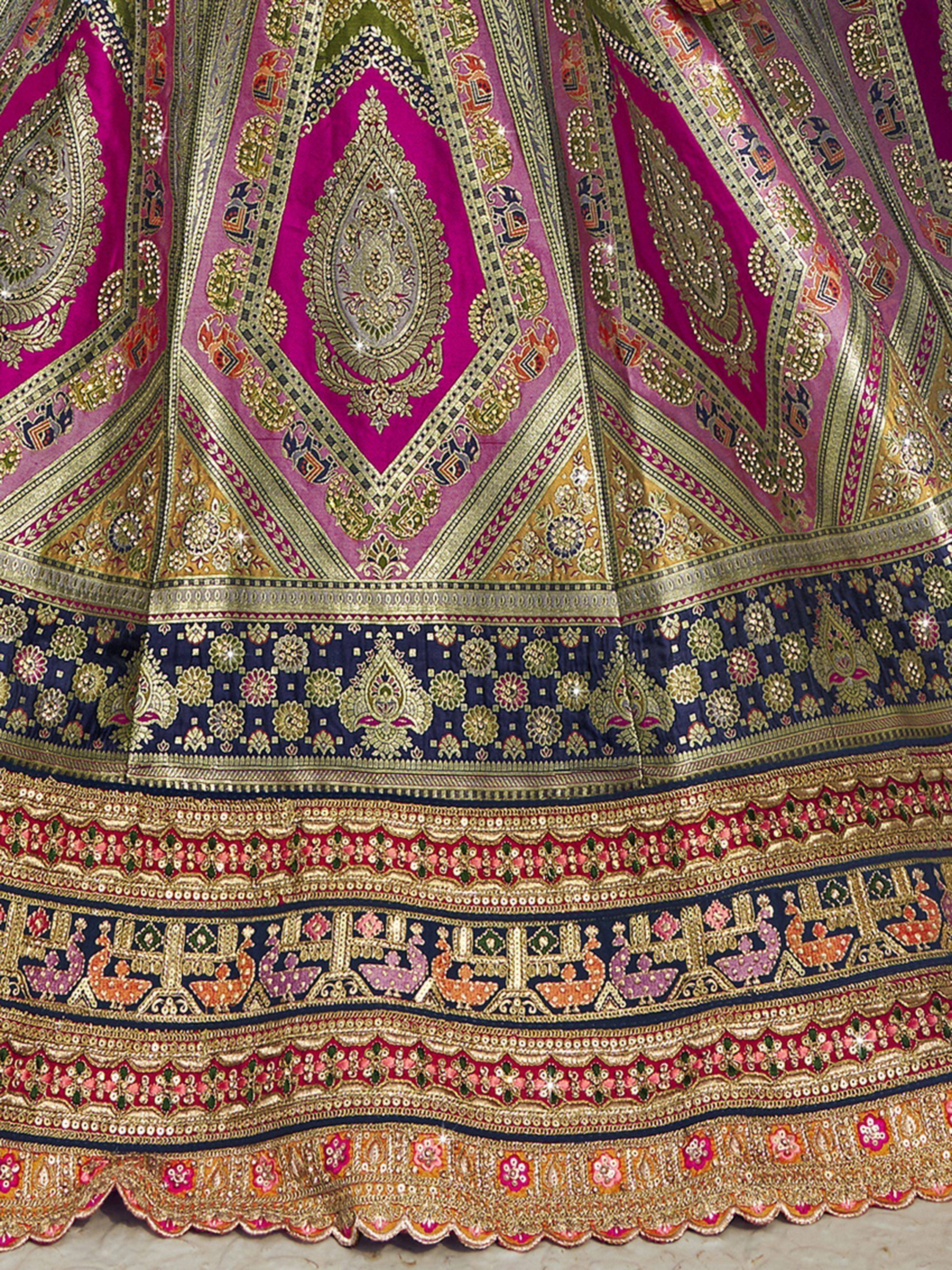 Pink and gold embroidered lehenga skirt with intricate paisley and peacock motifs, perfect for Indian ethnic wear.