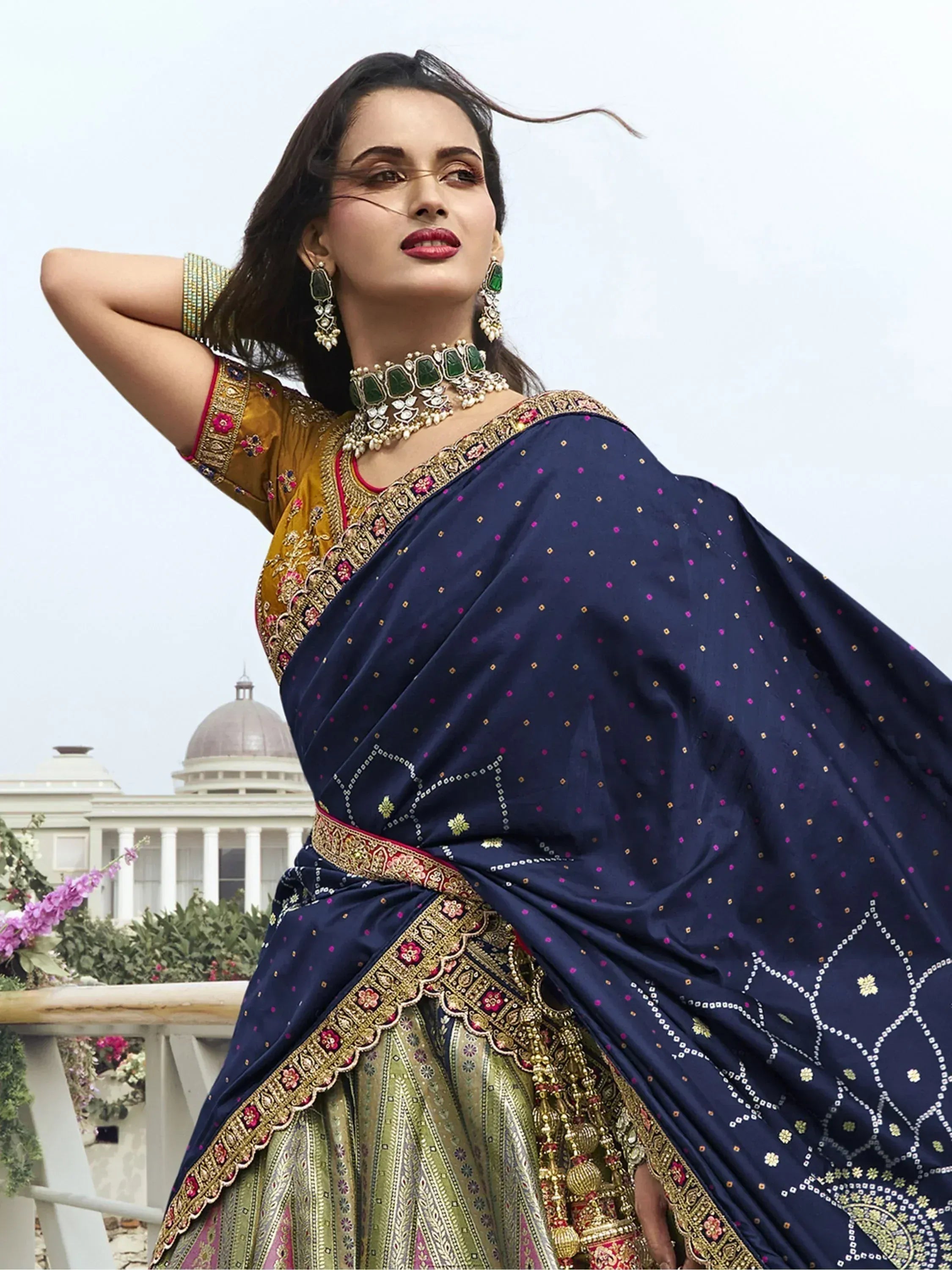 Elegant navy blue saree with gold embroidery, paired with designer blouse and traditional jewelry for Indian ethnic wear
