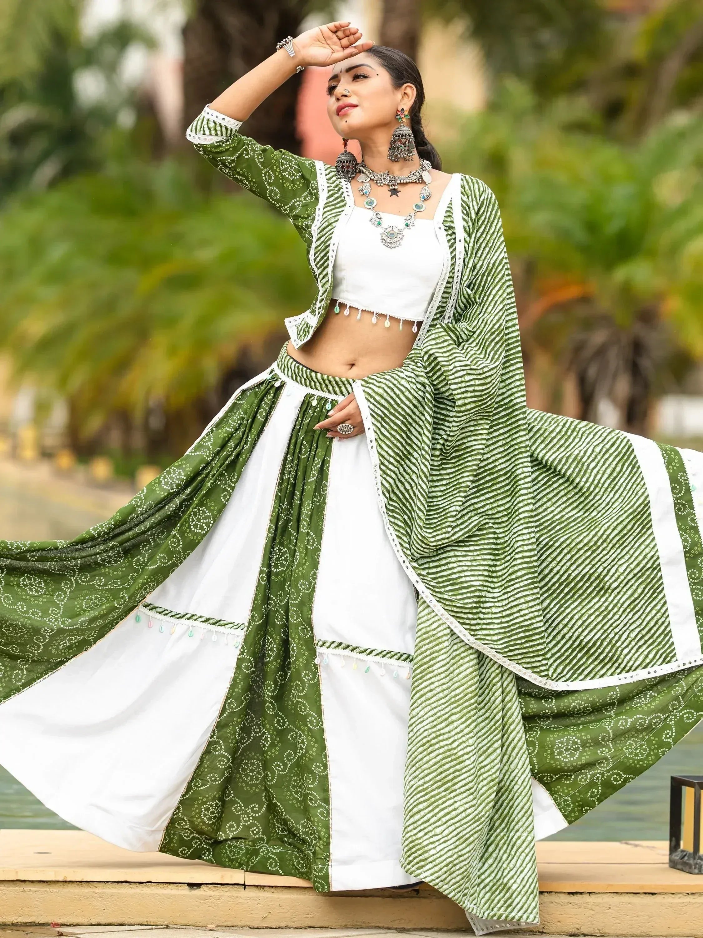 Green and white printed ethnic lehenga choli with dupatta, perfect for Indian festive occasions