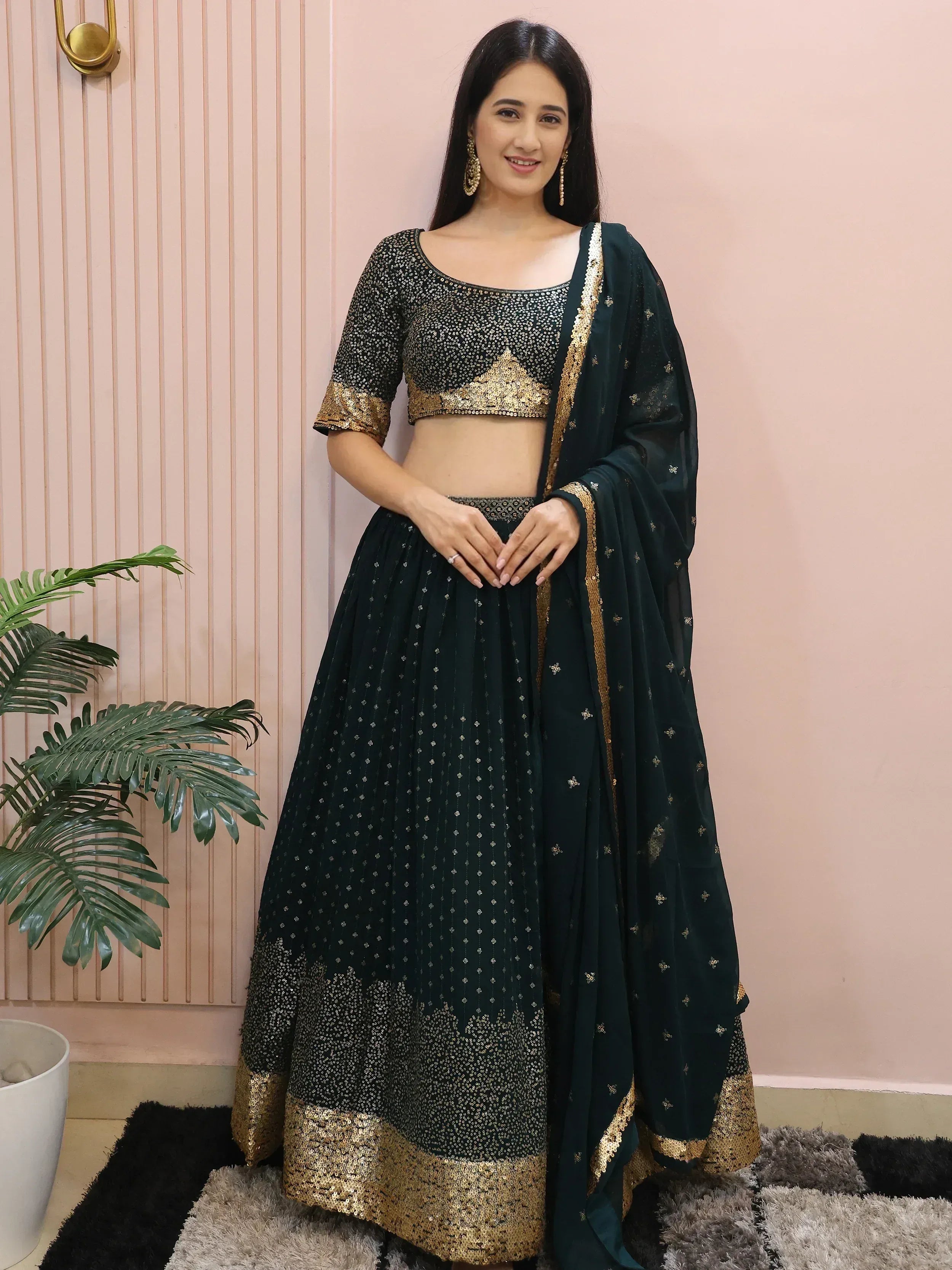 Emerald green lehenga choli with gold sequin work, perfect for Indian ethnic wear and festive occasions.