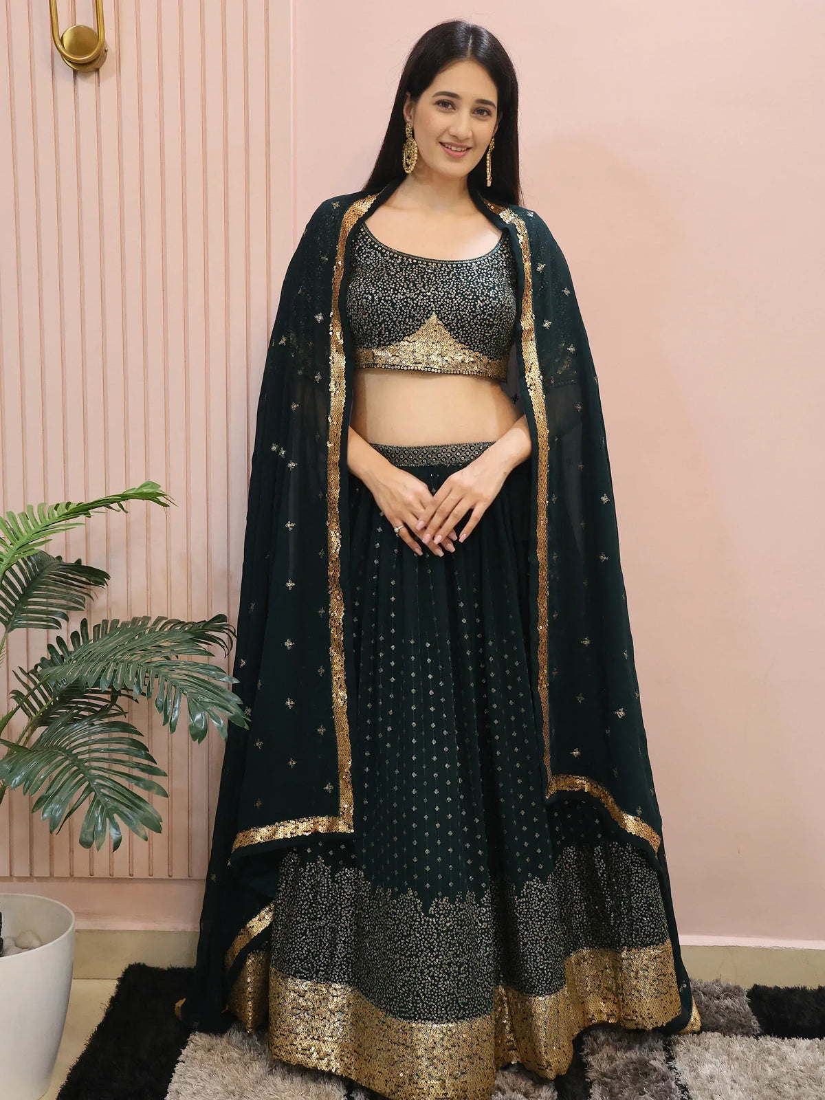 Elegant dark green lehenga choli with gold sequin work, perfect for Indian ethnic occasions