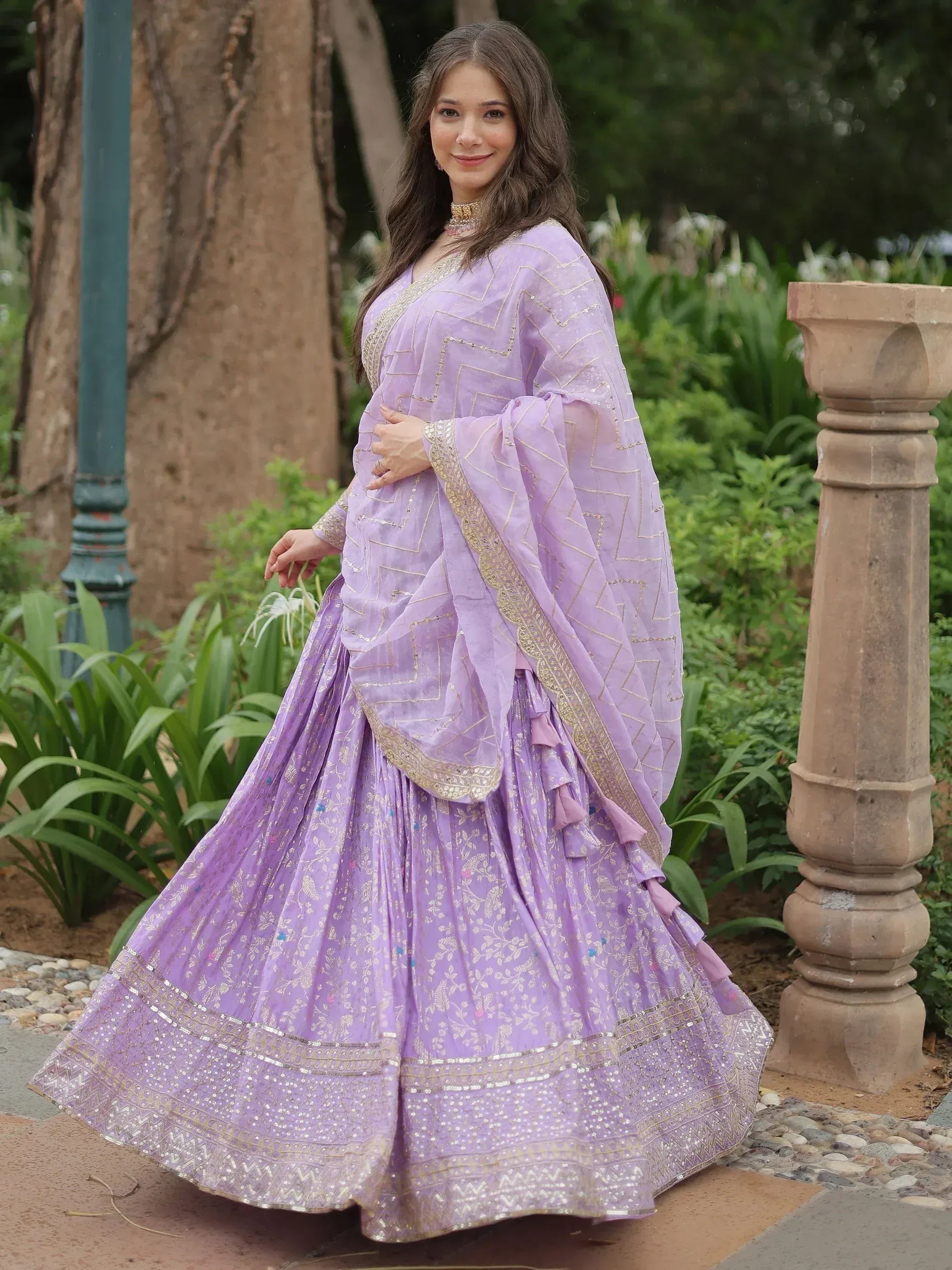 Lavender designer lehenga choli with gold embroidery, perfect for Indian ethnic wear and festive occasions.