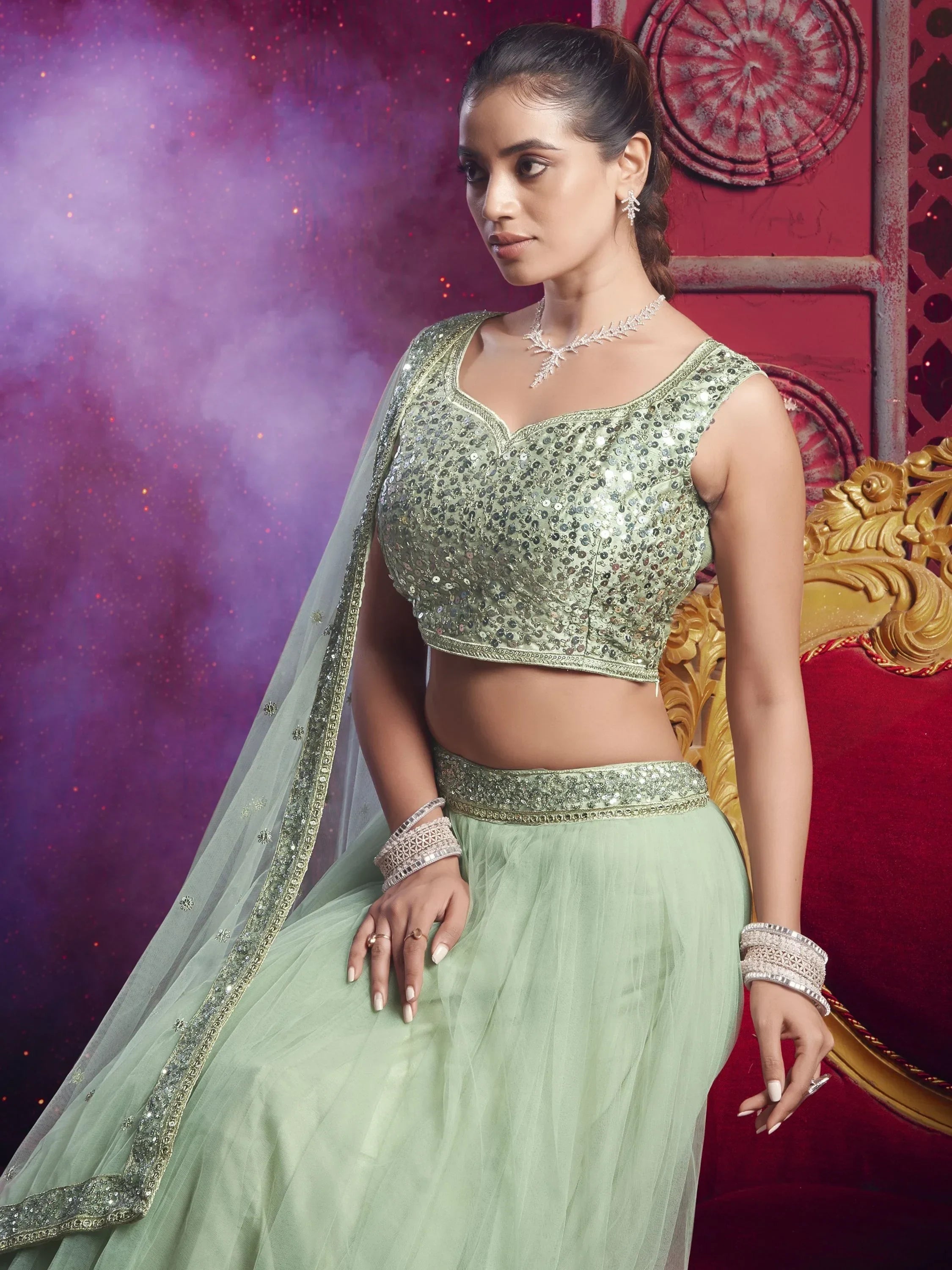 Mint green sequin lehenga choli with sheer dupatta, perfect for Indian weddings and festive occasions.