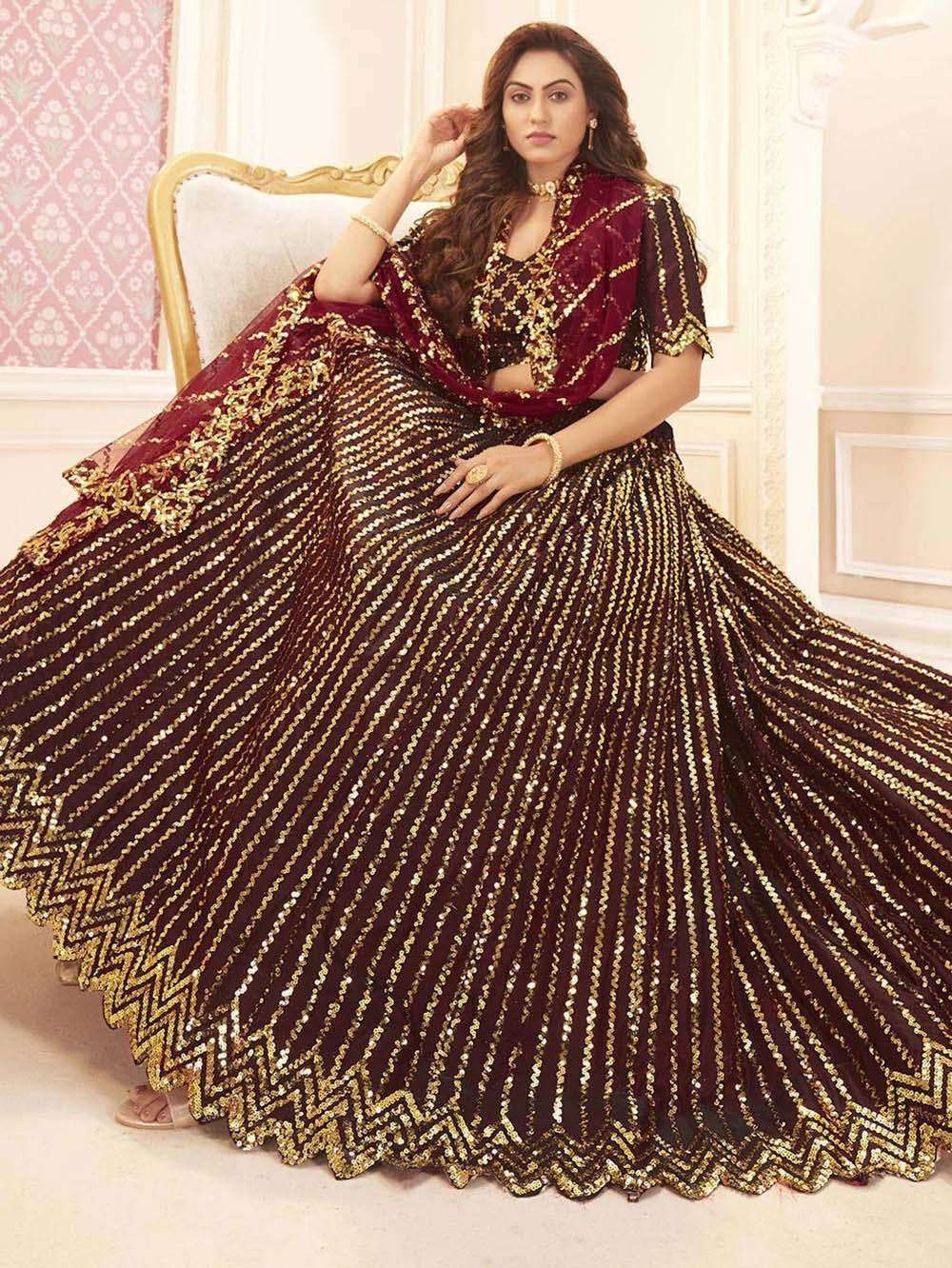 Maroon and gold sequin lehenga choli with intricate embroidery, perfect for Indian ethnic wear and festive occasions.