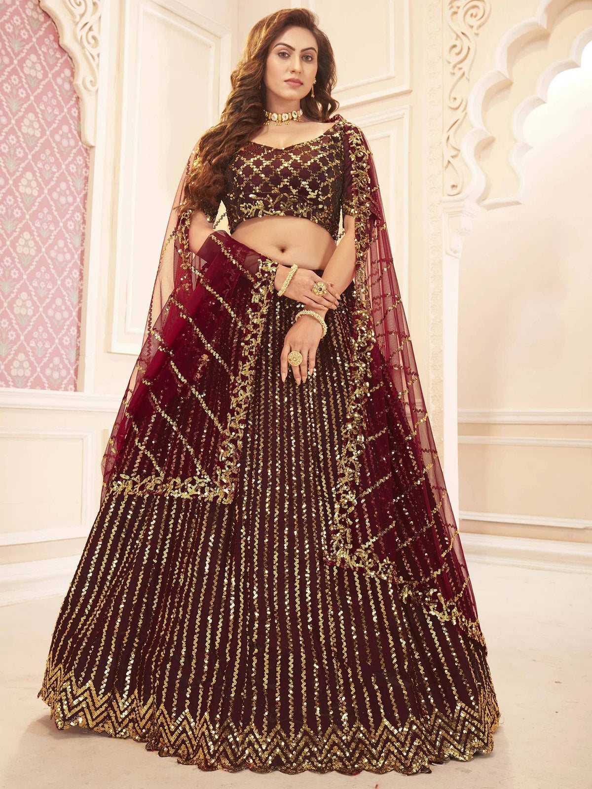 Maroon and gold sequined lehenga choli with sheer dupatta, Indian ethnic wear for weddings