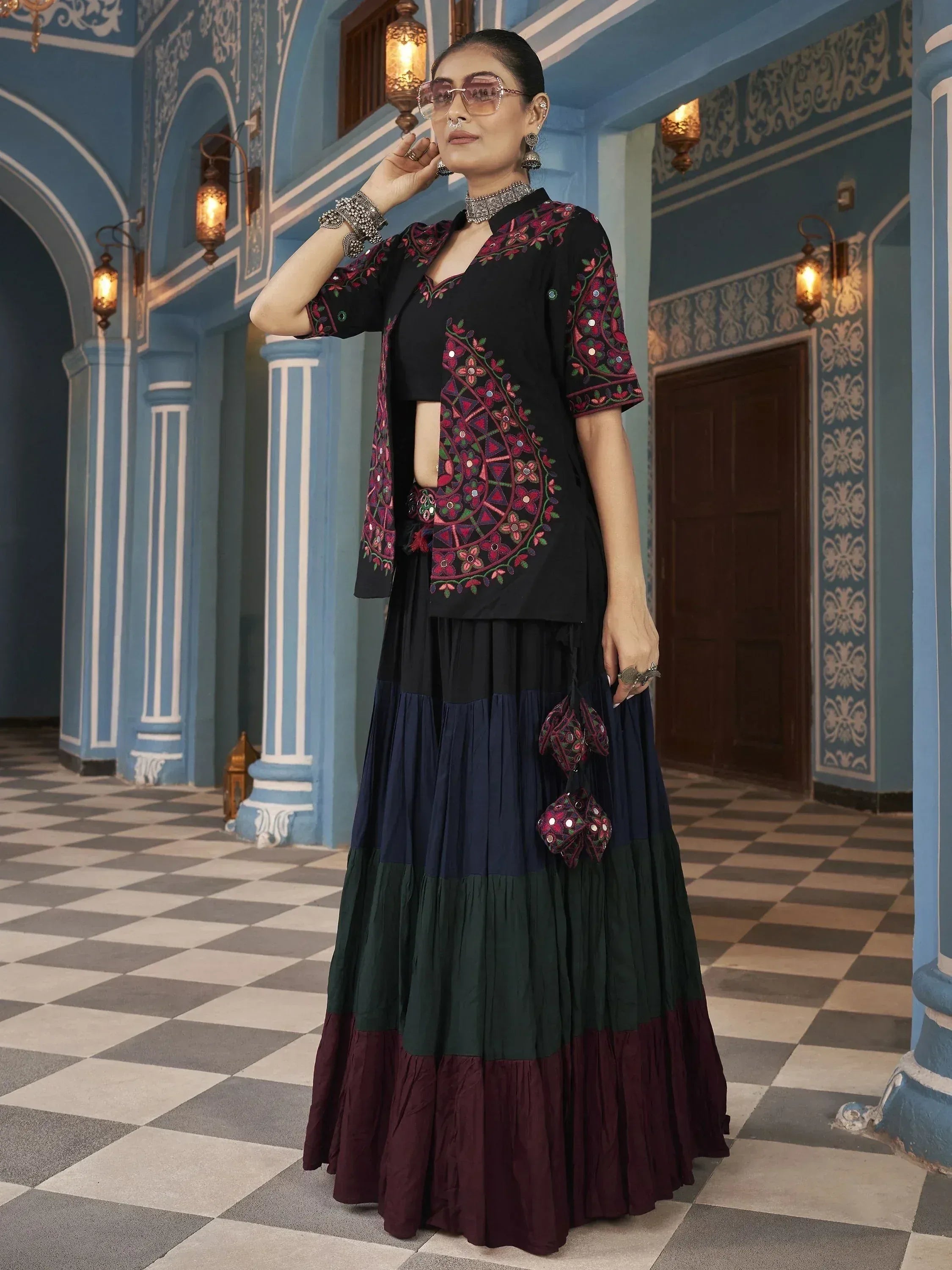 Black embroidered ethnic gown with tiered skirt, perfect for Indian occasions and festive wear.