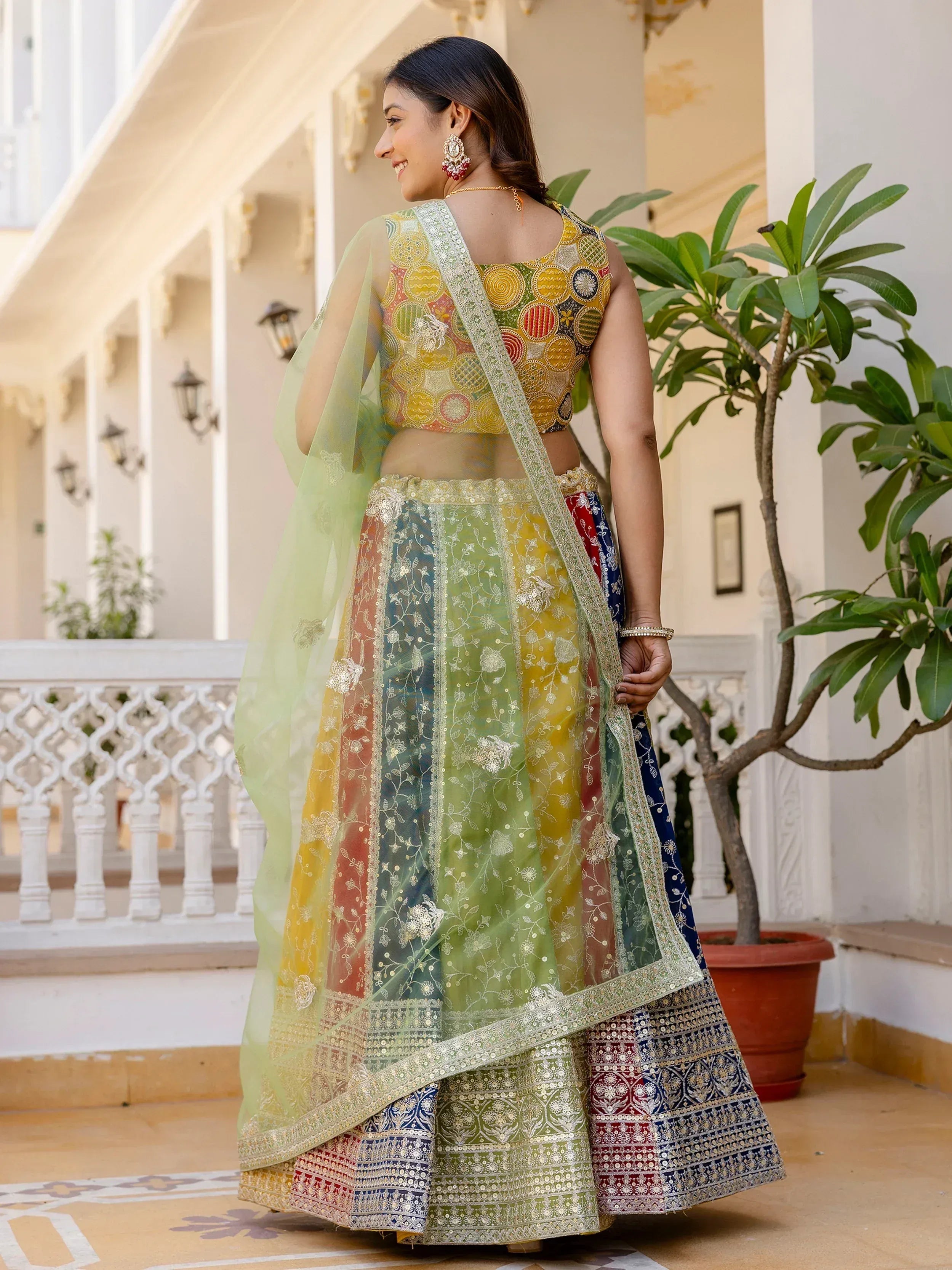 Colorful embroidered lehenga choli with floral dupatta, perfect for Indian ethnic occasions