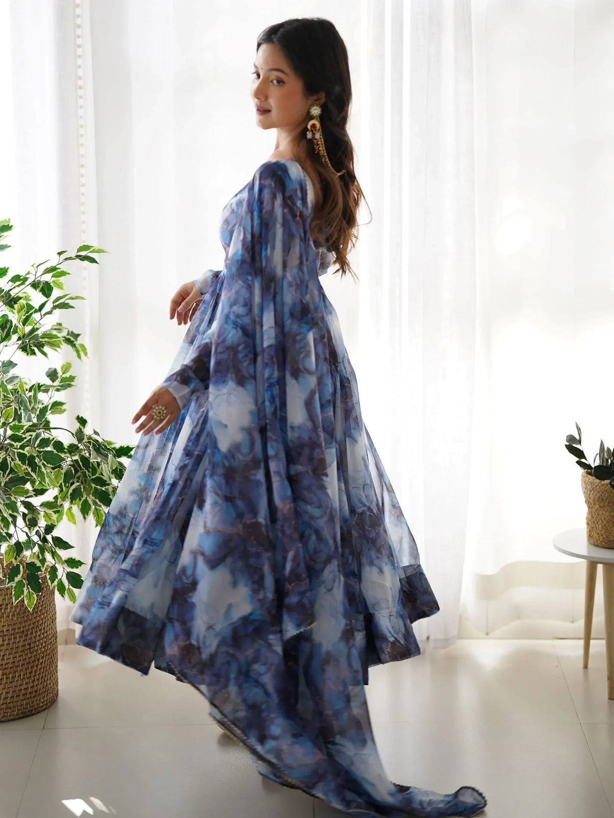 Blue floral print ethnic gown with flared skirt, perfect for Indian occasions and festive wear.