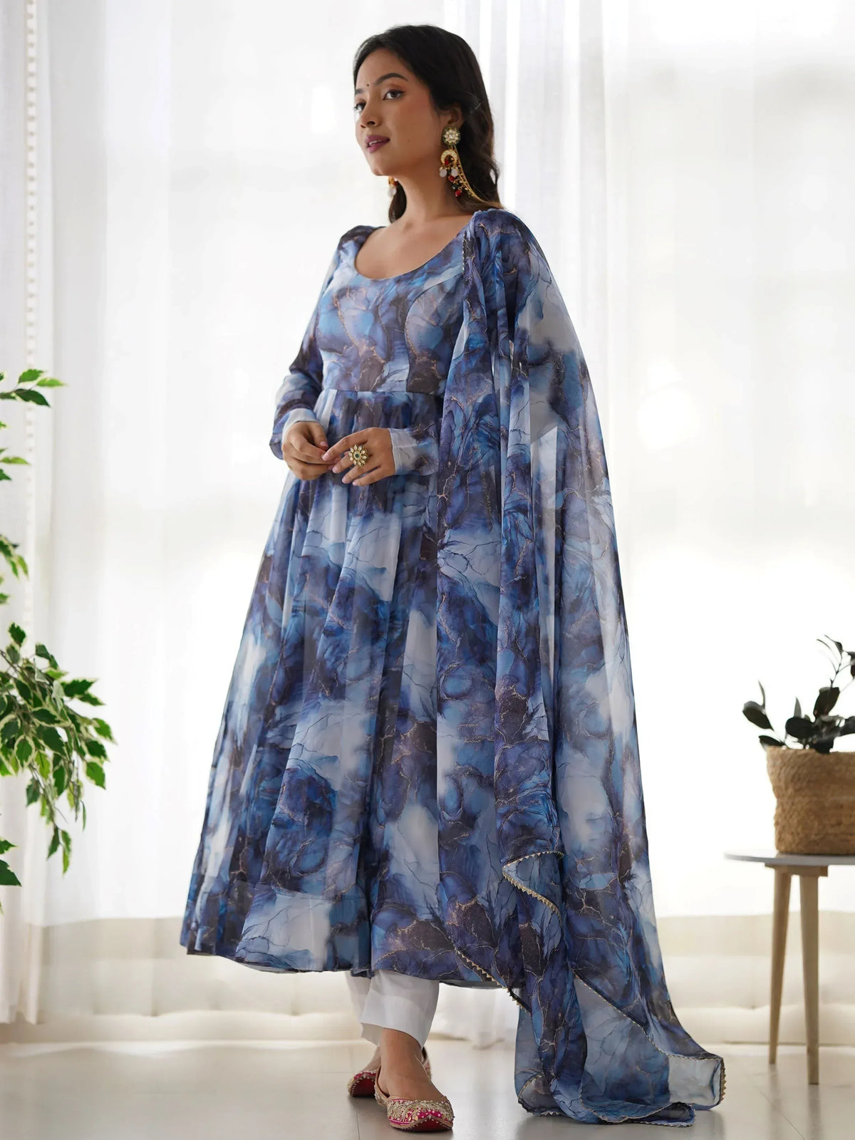 Blue marble print ethnic anarkali gown with cape, styled with white pants and juttis for festive occasions