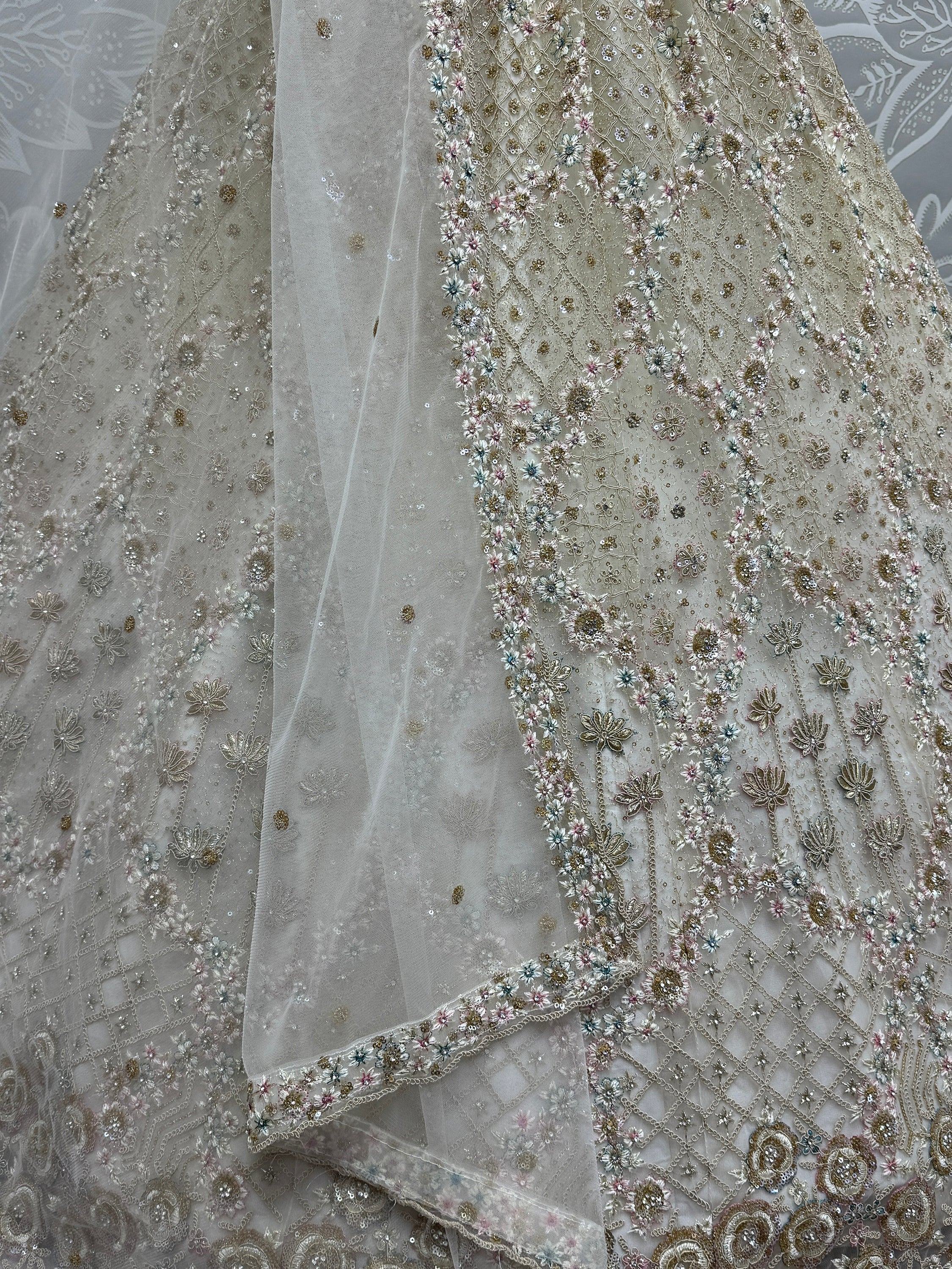 Elegant floral embroidered lehenga with delicate net dupatta, perfect for Indian ethnic wear