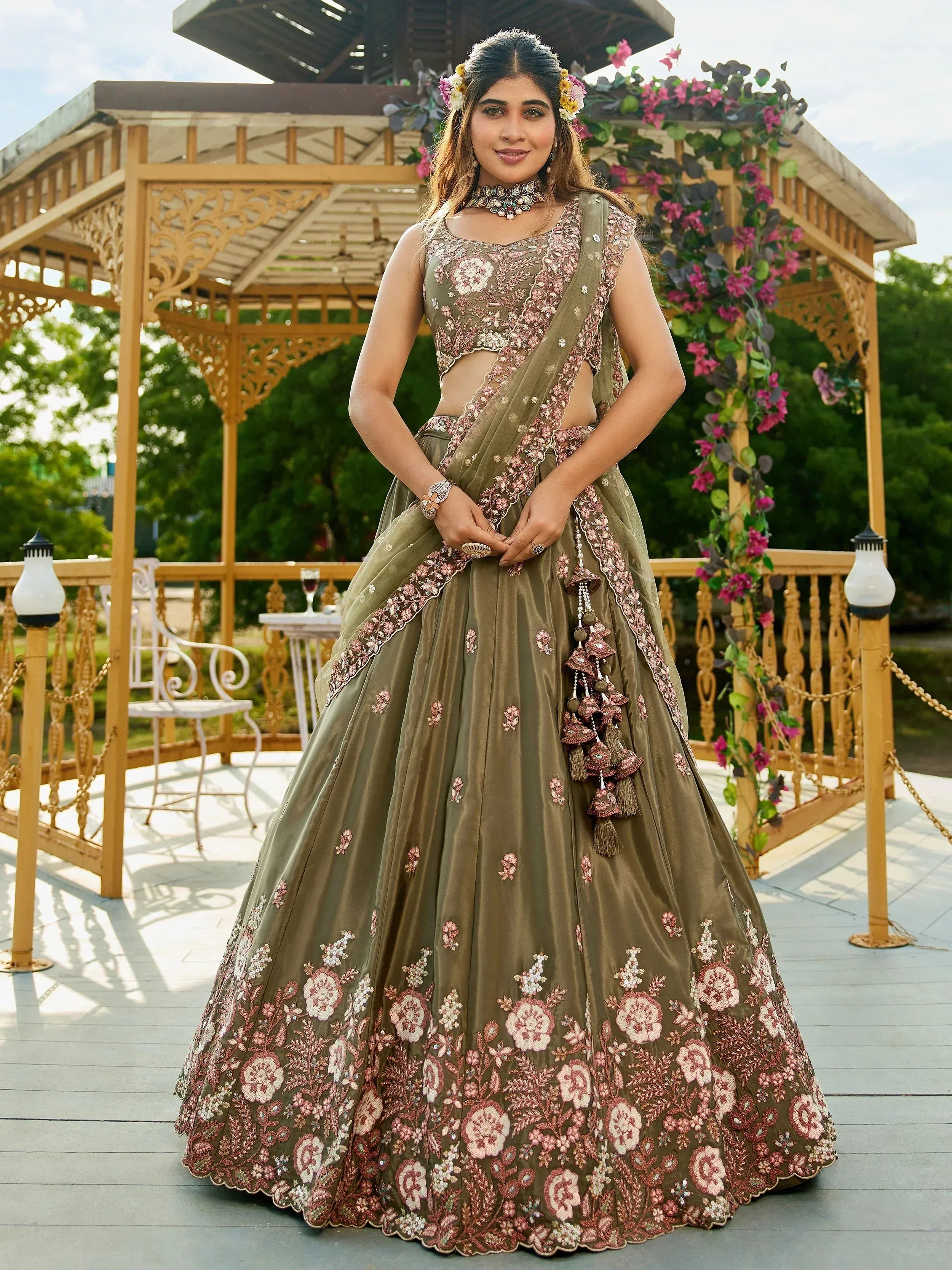Olive green floral embroidered lehenga choli with tassels, perfect for Indian ethnic wear events.