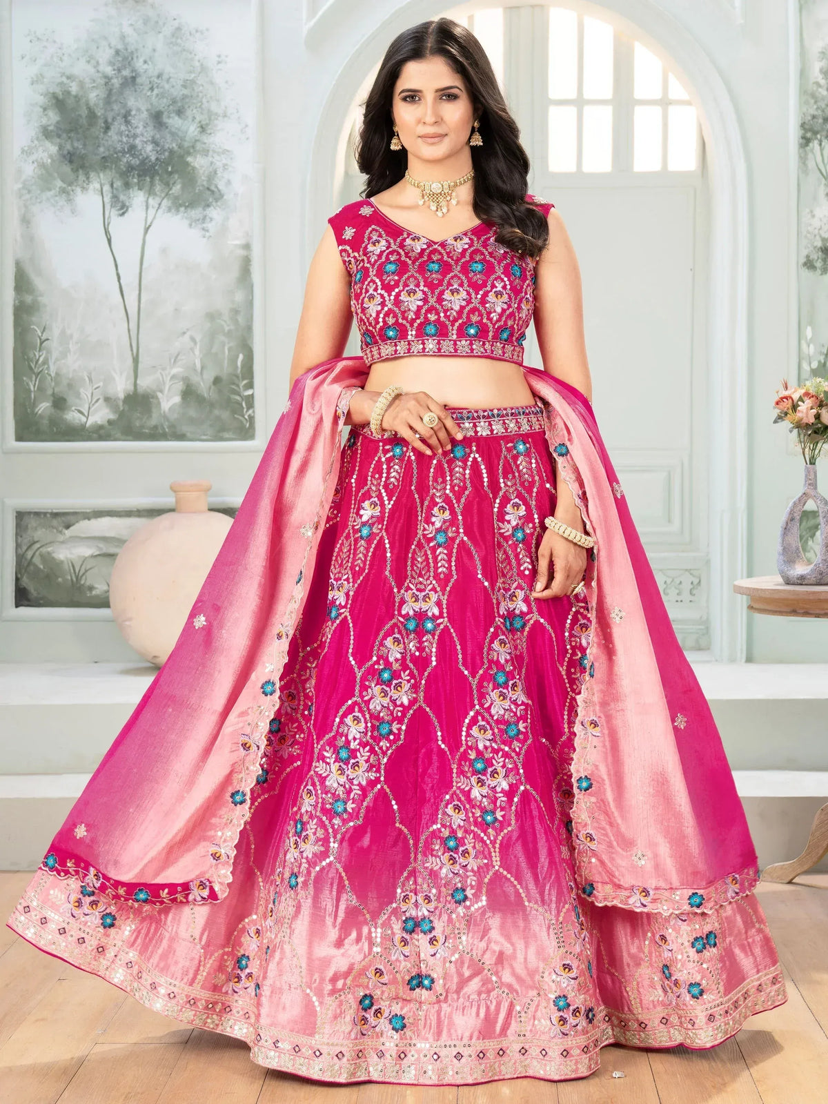 Pink embroidered lehenga choli with floral motifs and dupatta, ideal for Indian ethnic wear occasions