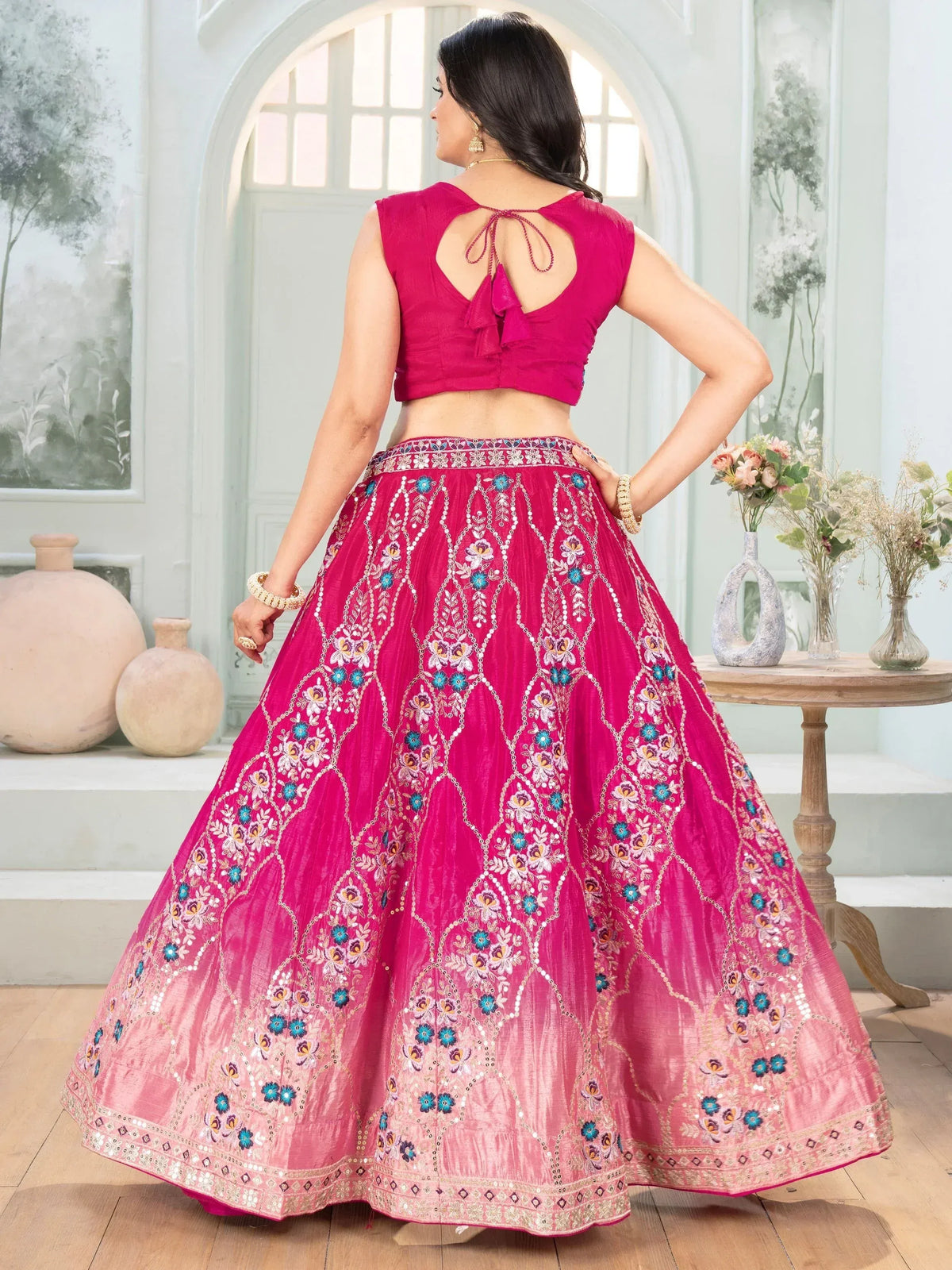 Pink embroidered lehenga choli with floral motifs and back tie blouse, ideal for Indian ethnic wear
