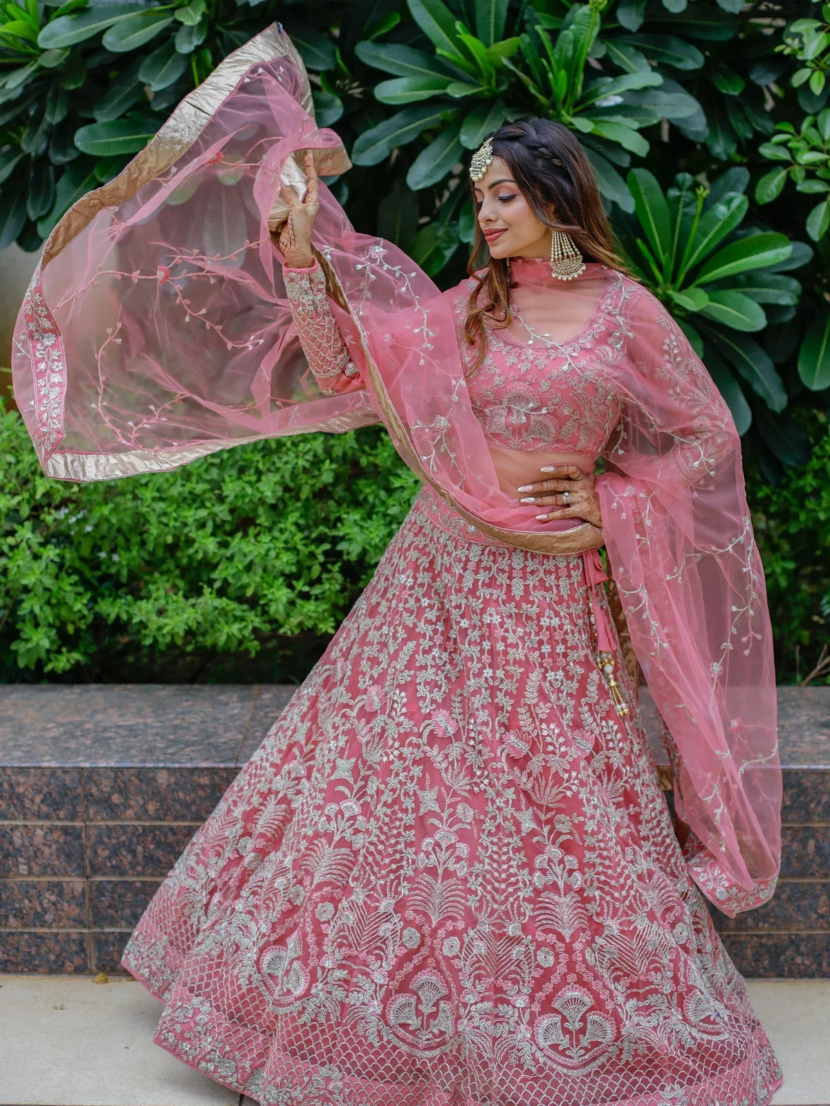 Pink embroidered lehenga choli with sheer dupatta, perfect for Indian weddings and festive occasions