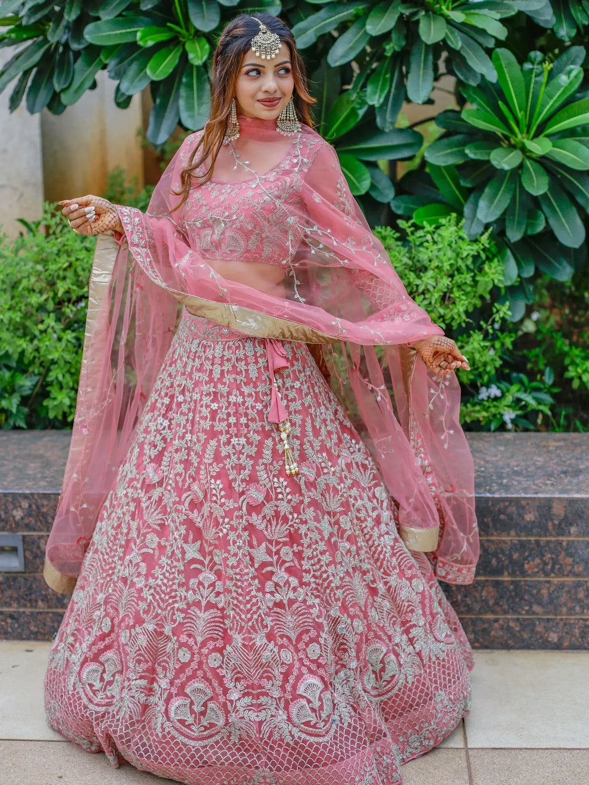 Pink embroidered lehenga choli with sheer dupatta, perfect for Indian weddings and festive occasions