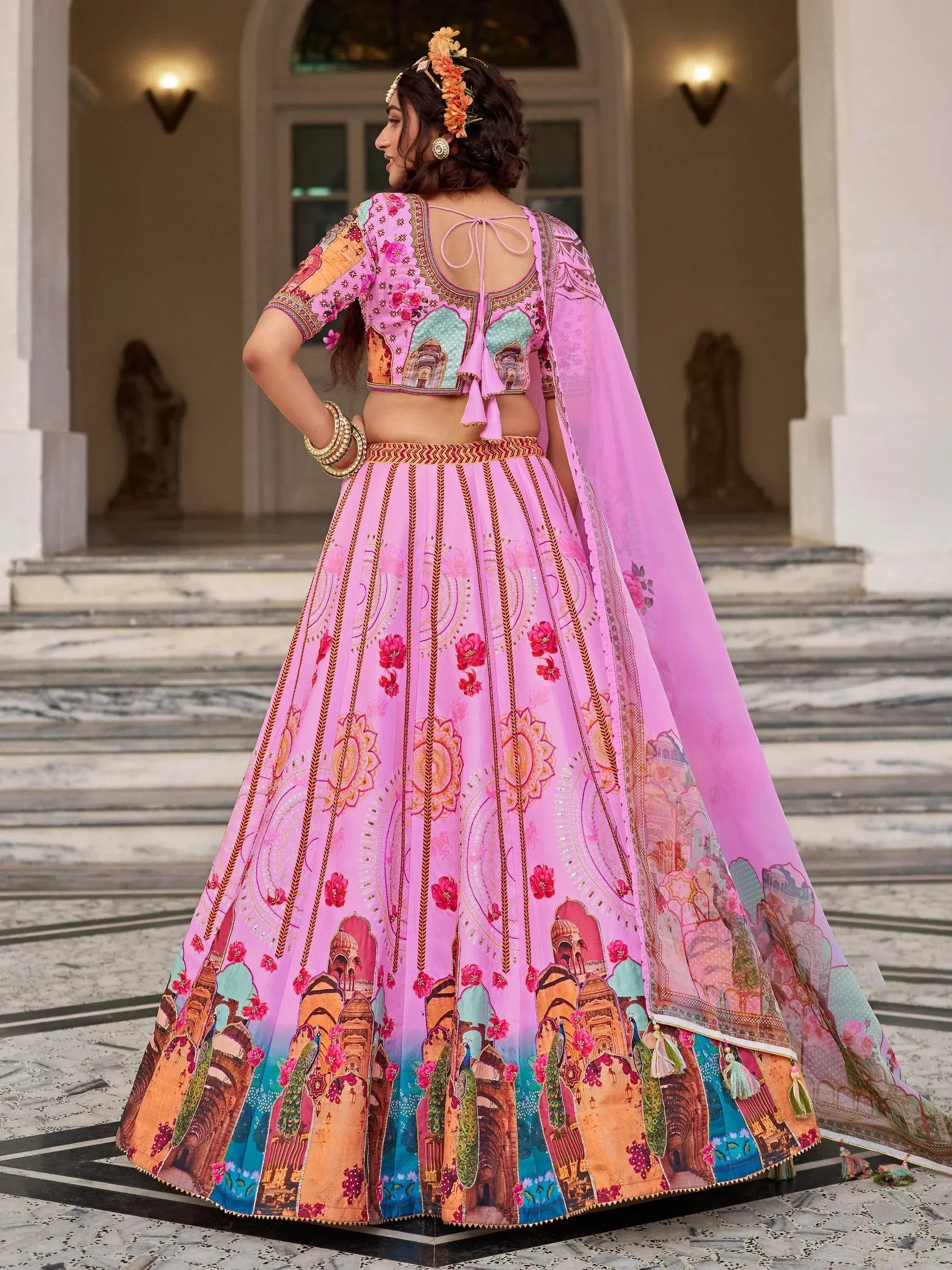 Pink printed lehenga choli with peacock and palace motifs, perfect for Indian ethnic wear occasions
