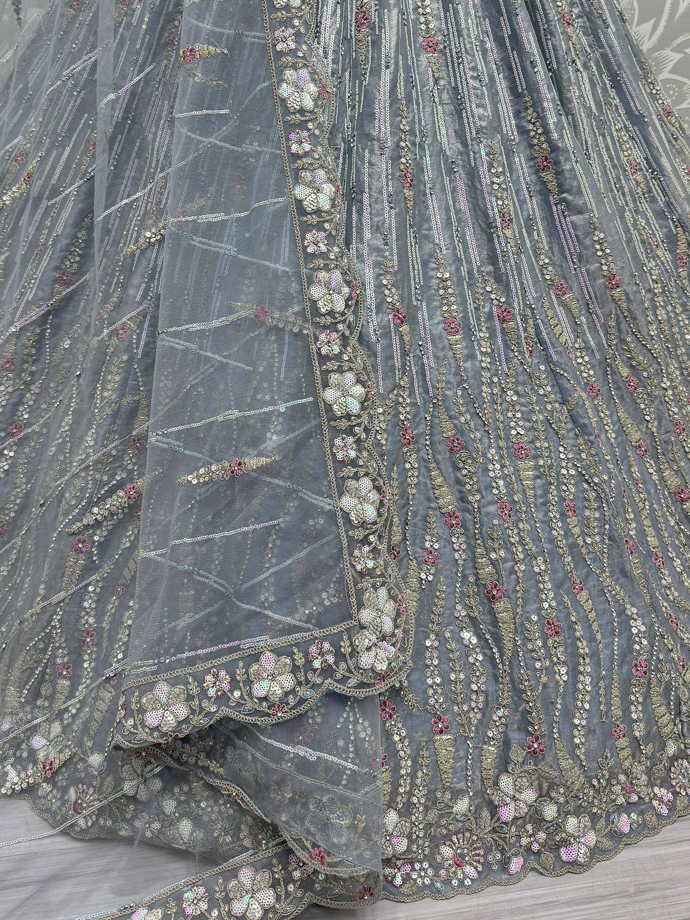 Grey designer lehenga with floral sequin embroidery and sheer overlay, perfect for Indian ethnic wear events.