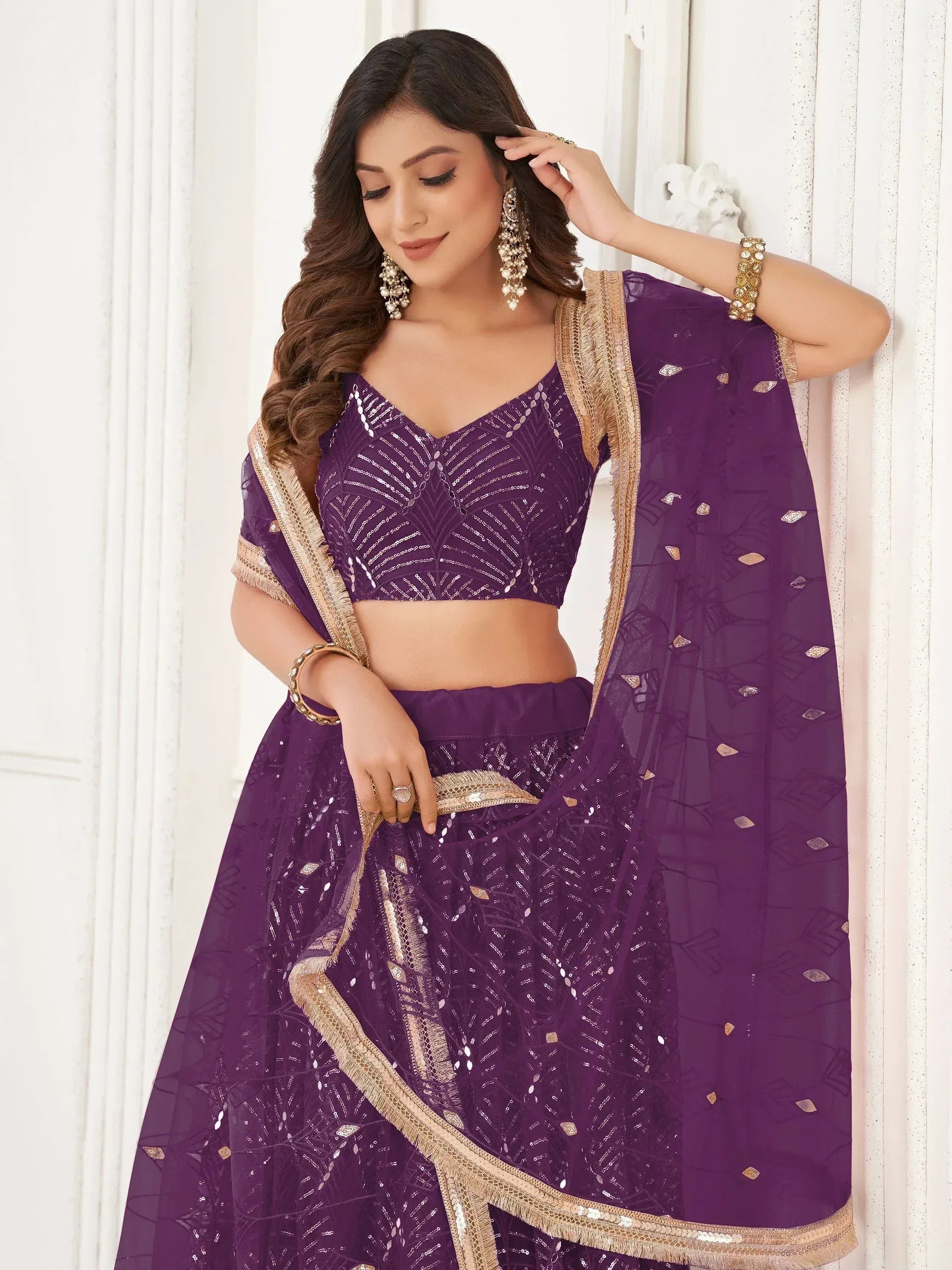 Purple designer lehenga choli with gold embroidery and sequins, perfect for Indian ethnic wear occasions